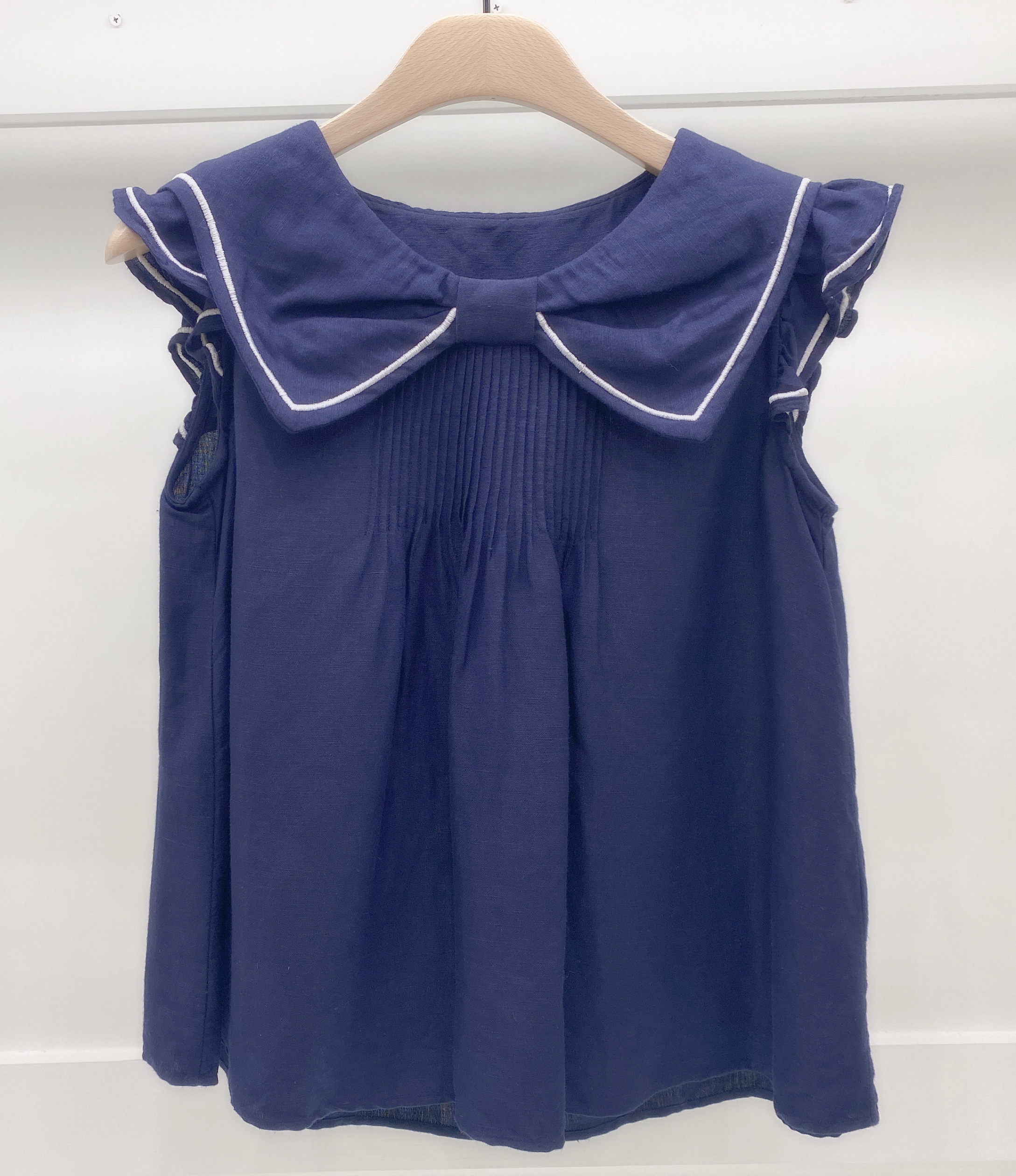 胸蝴蝶結荷袖上衣