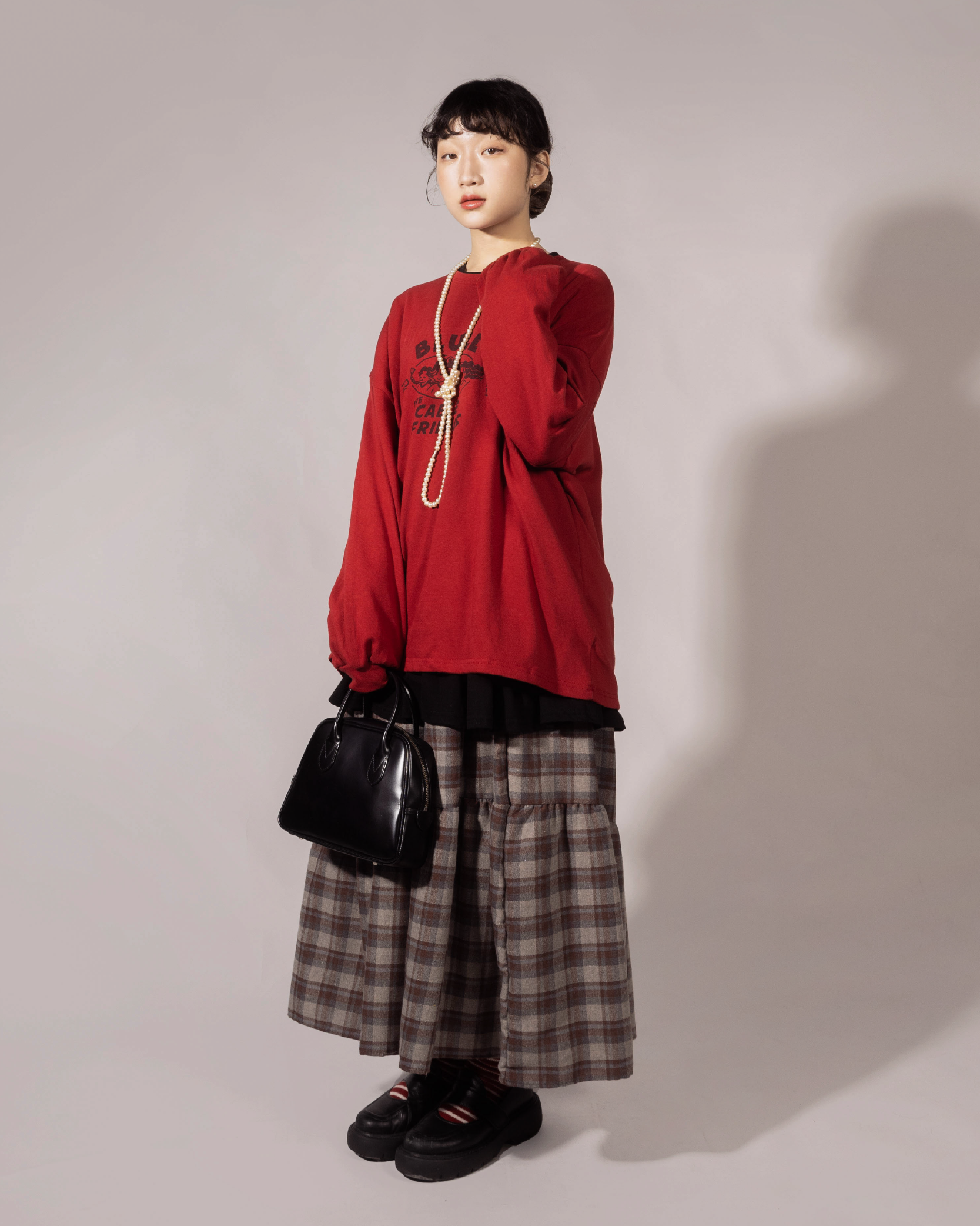 磨毛格紋斜層層蛋糕半裙