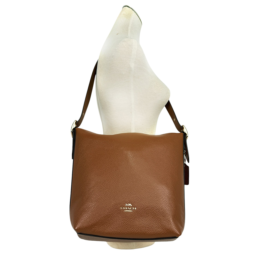 【COACH】Val 金字荔枝皮革斜背水桶包(紅棕木色)C2818 IMR1W