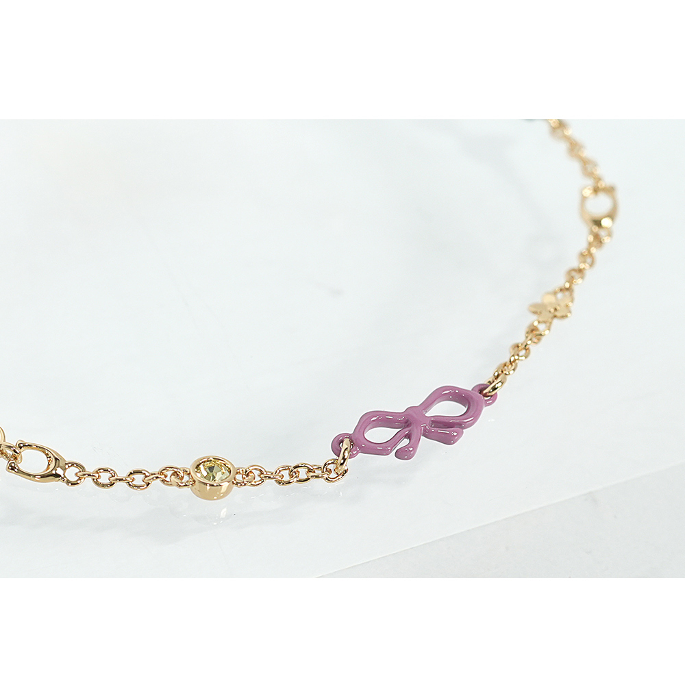 【COACH】彩色樹脂蝴蝶結及玻璃水鑽不可調手鍊(金色)CAD69 GDMC