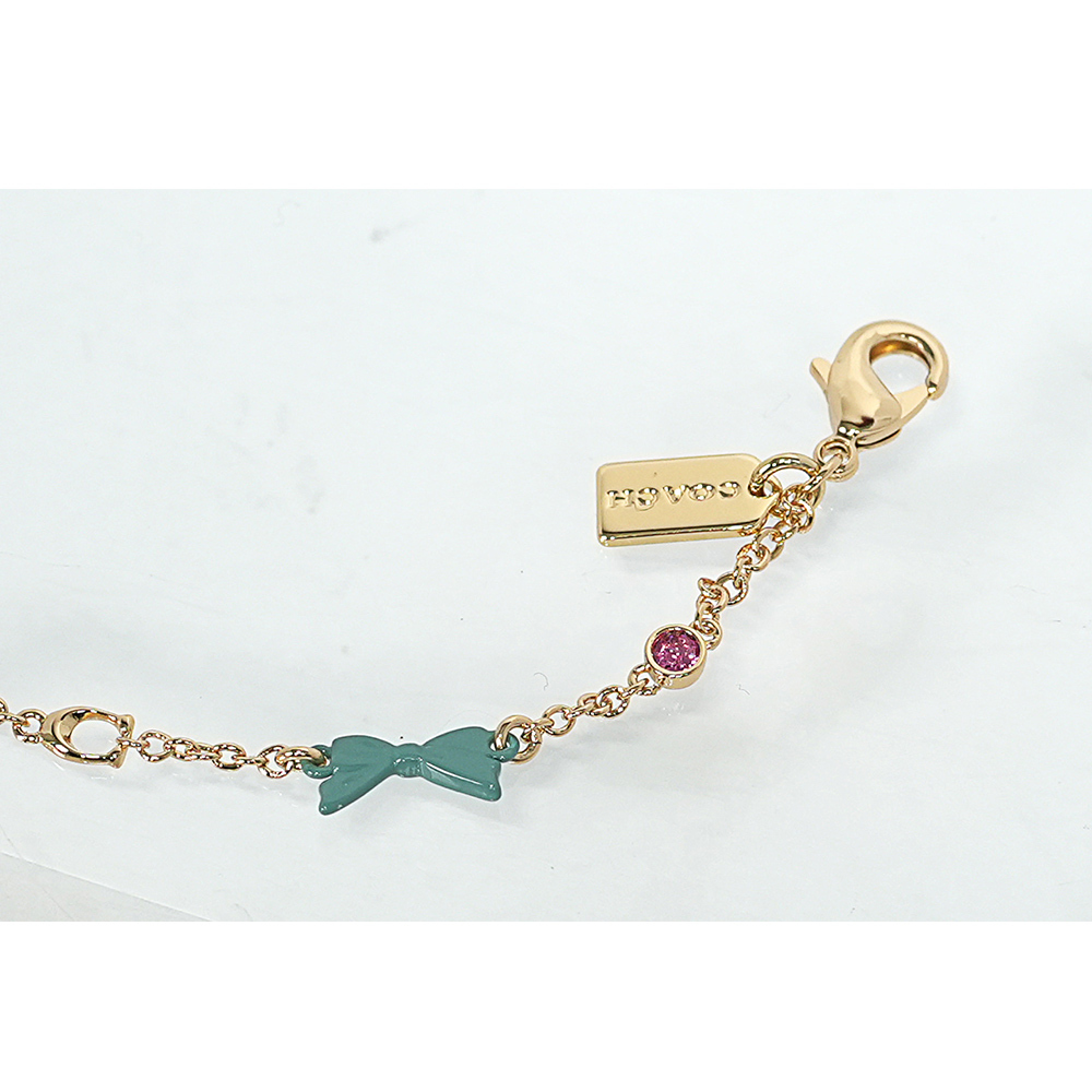 【COACH】彩色樹脂蝴蝶結及玻璃水鑽不可調手鍊(金色)CAD69 GDMC