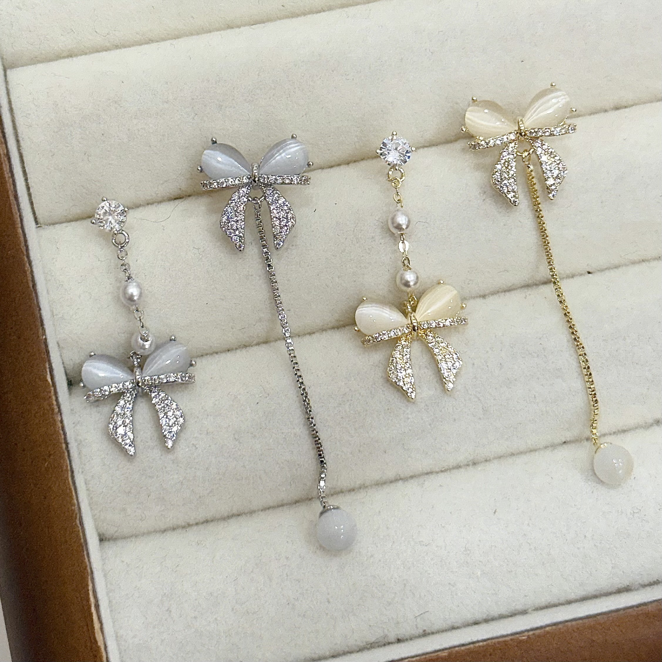 M58珍珠排鑽貓眼蝴蝶結不對稱垂吊