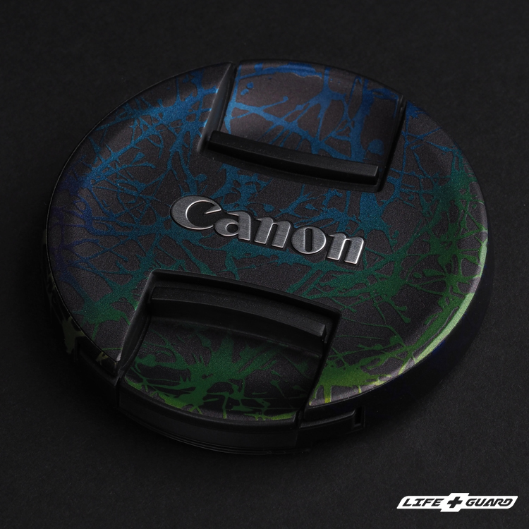 Canon RF 16-28mm F2.8 IS STM 鏡頭蓋貼膜展示圖，LIFE+GUARD 潑墨風格