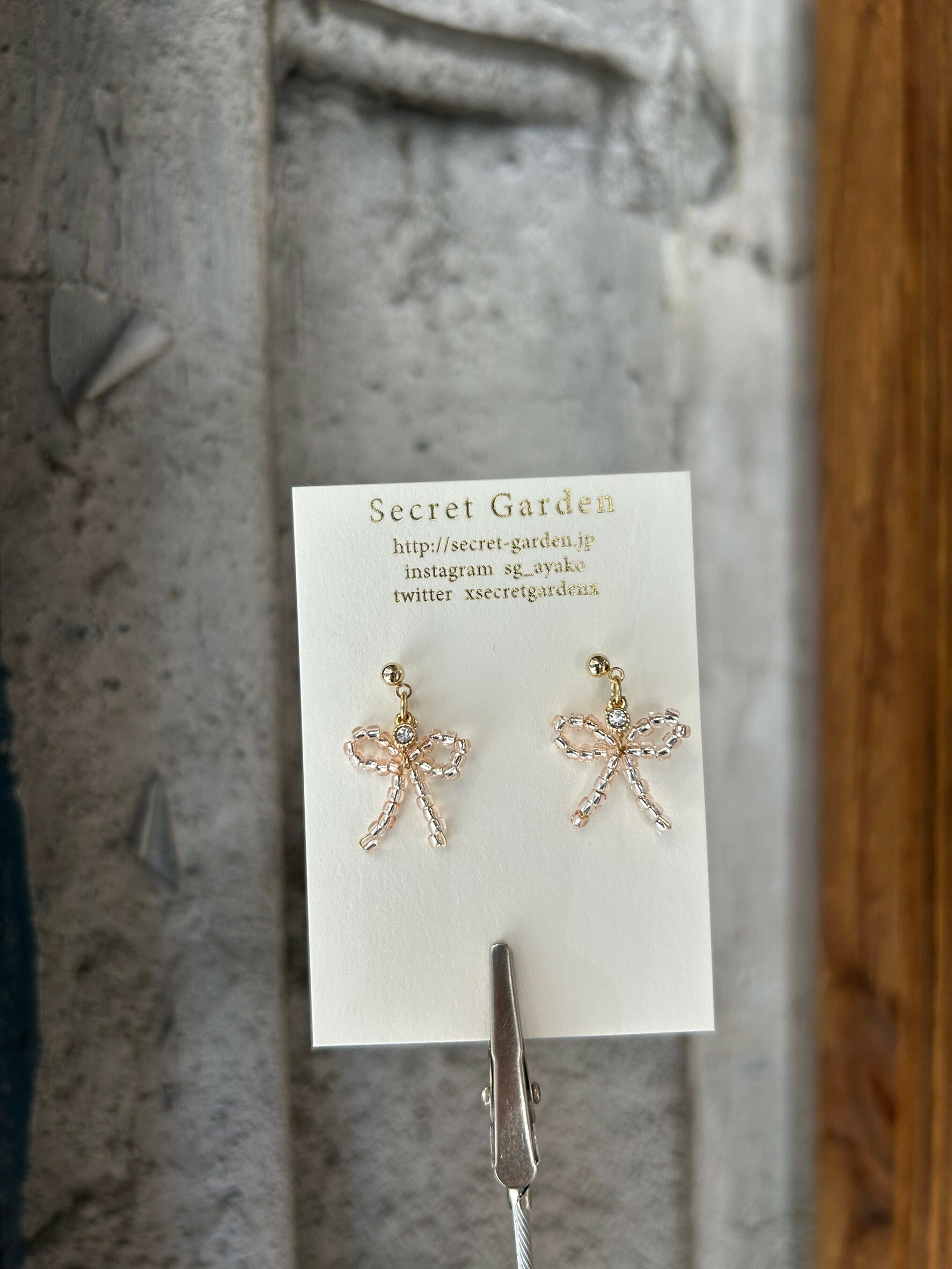 [secretgarden] 寶石串珠蝴蝶結耳環 | 銀粉色 | 耳夾 | NO.44