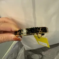 [S] MARC JACOBS BLACK/GOLD J105MT7PF22 THE MEDALLION LARGE BANGLE BRACELET, 191267996240 (SMJ473)