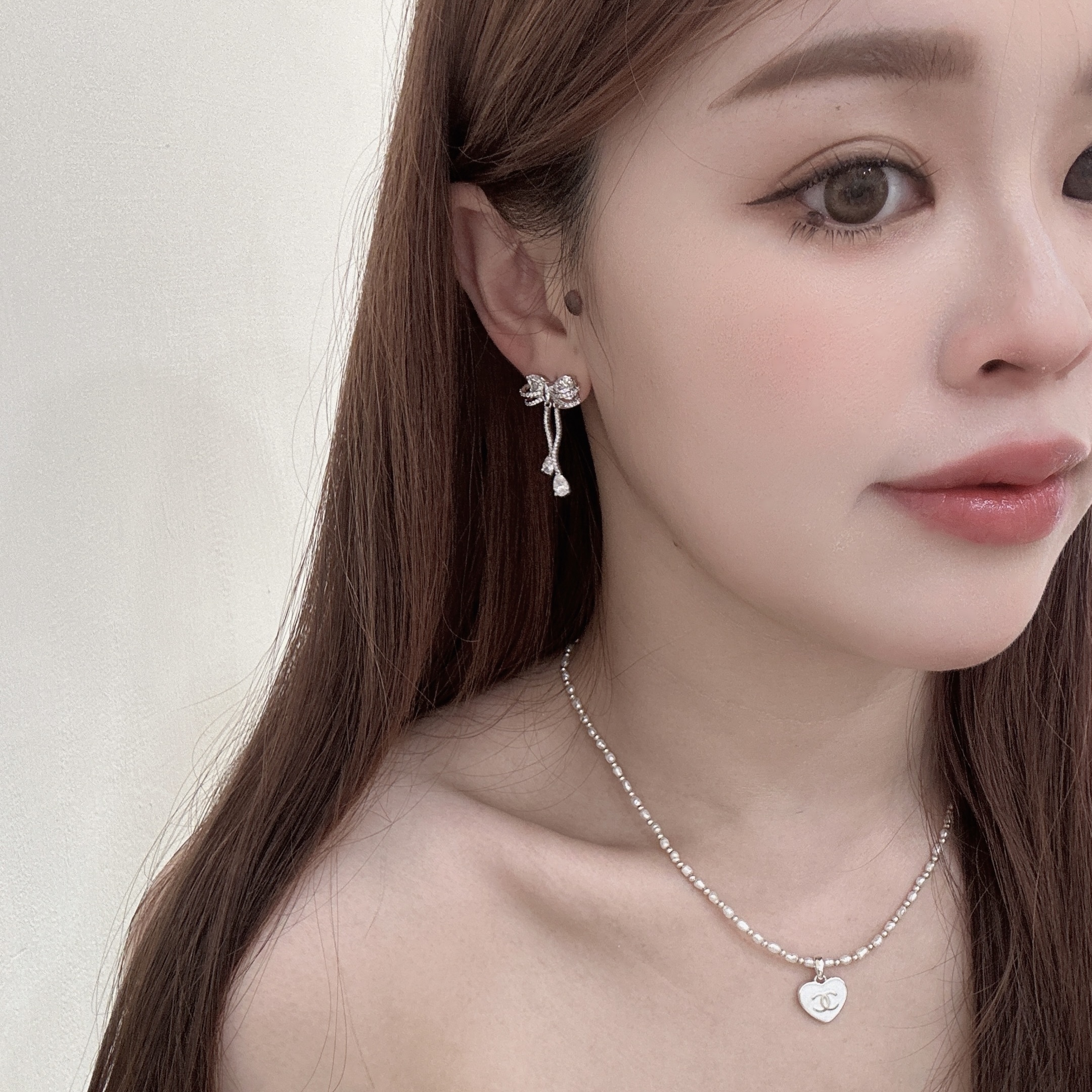 M90鋯石排鑽蝴蝶結波浪垂吊