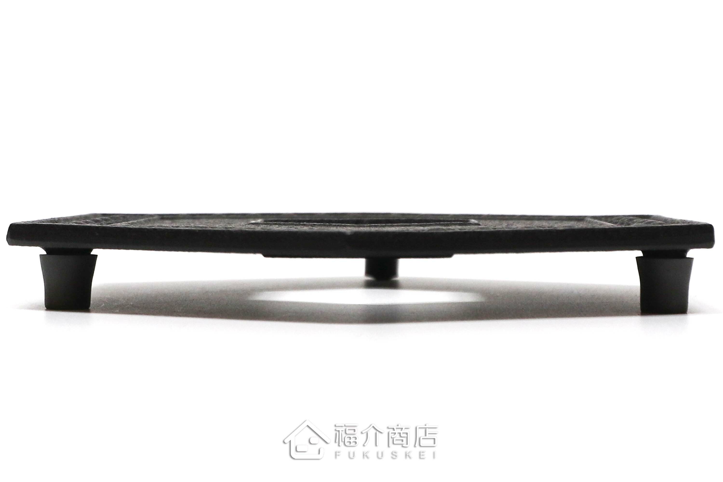 黑色六角龜甲造型放茶壺或鍋子的鑄鐵隔熱墊