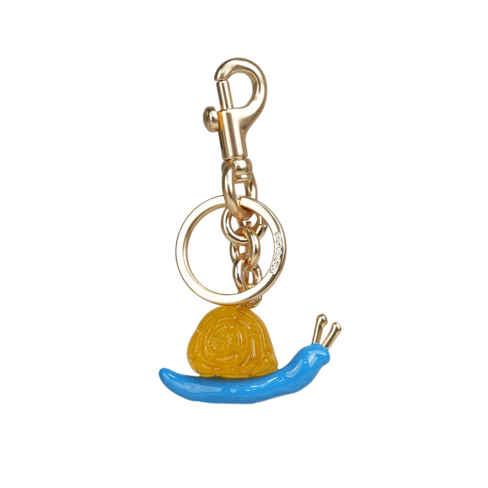 【COACH】COACH X OBSERVED BY US 蝸牛造型吊飾/鑰匙圈(金色/藍色) CU307 IMMTI