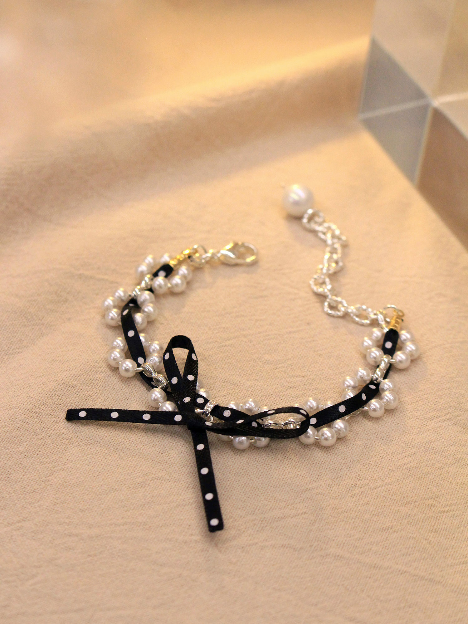 屬貓的莉莉。MUCHAT手作14KGP珍珠點點蝶結手鍊