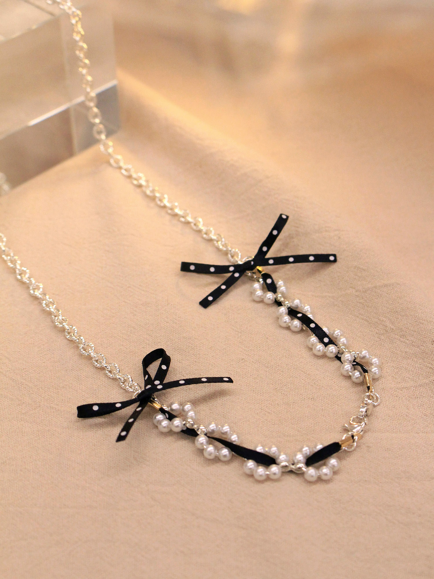 屬貓的莉莉。MUCHAT手作14KGP珍珠點點蝶結眼鏡鍊