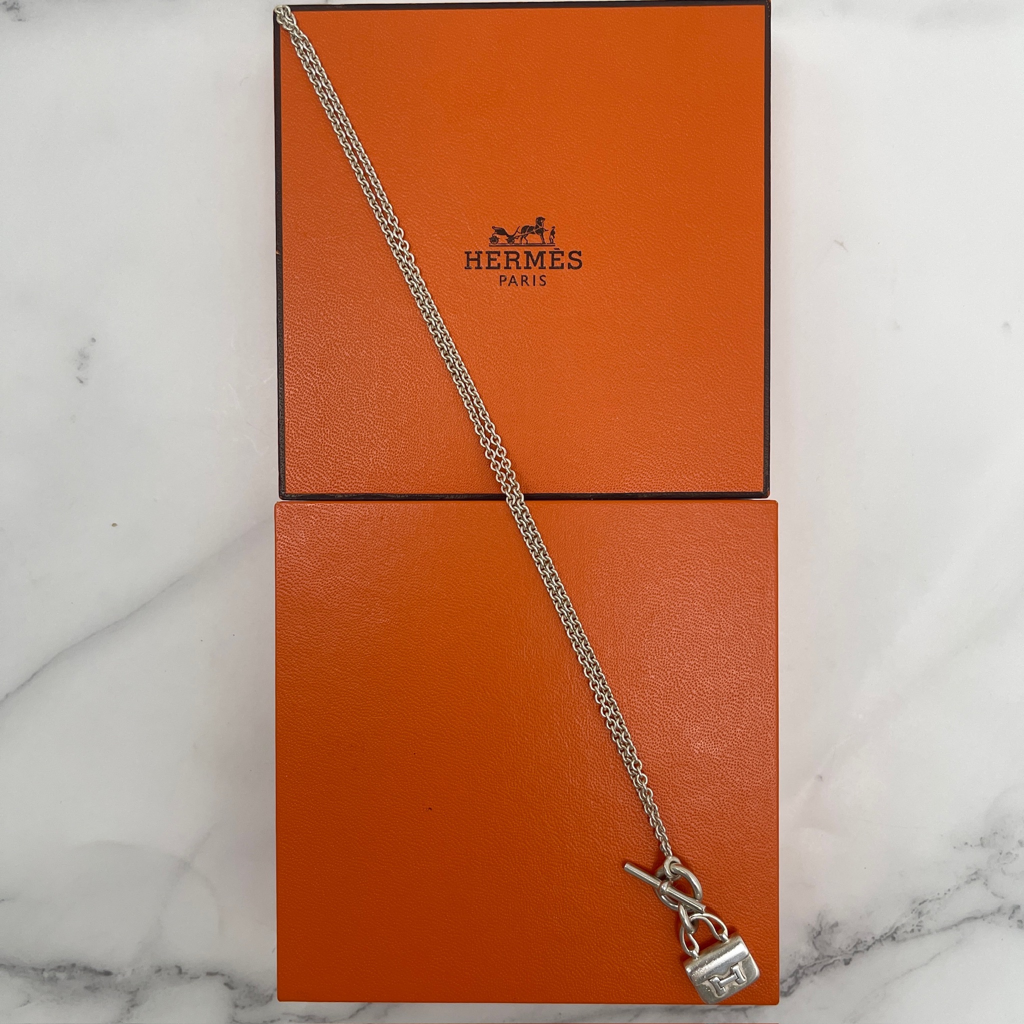 Hermes Amulettes Constance pendant necklace