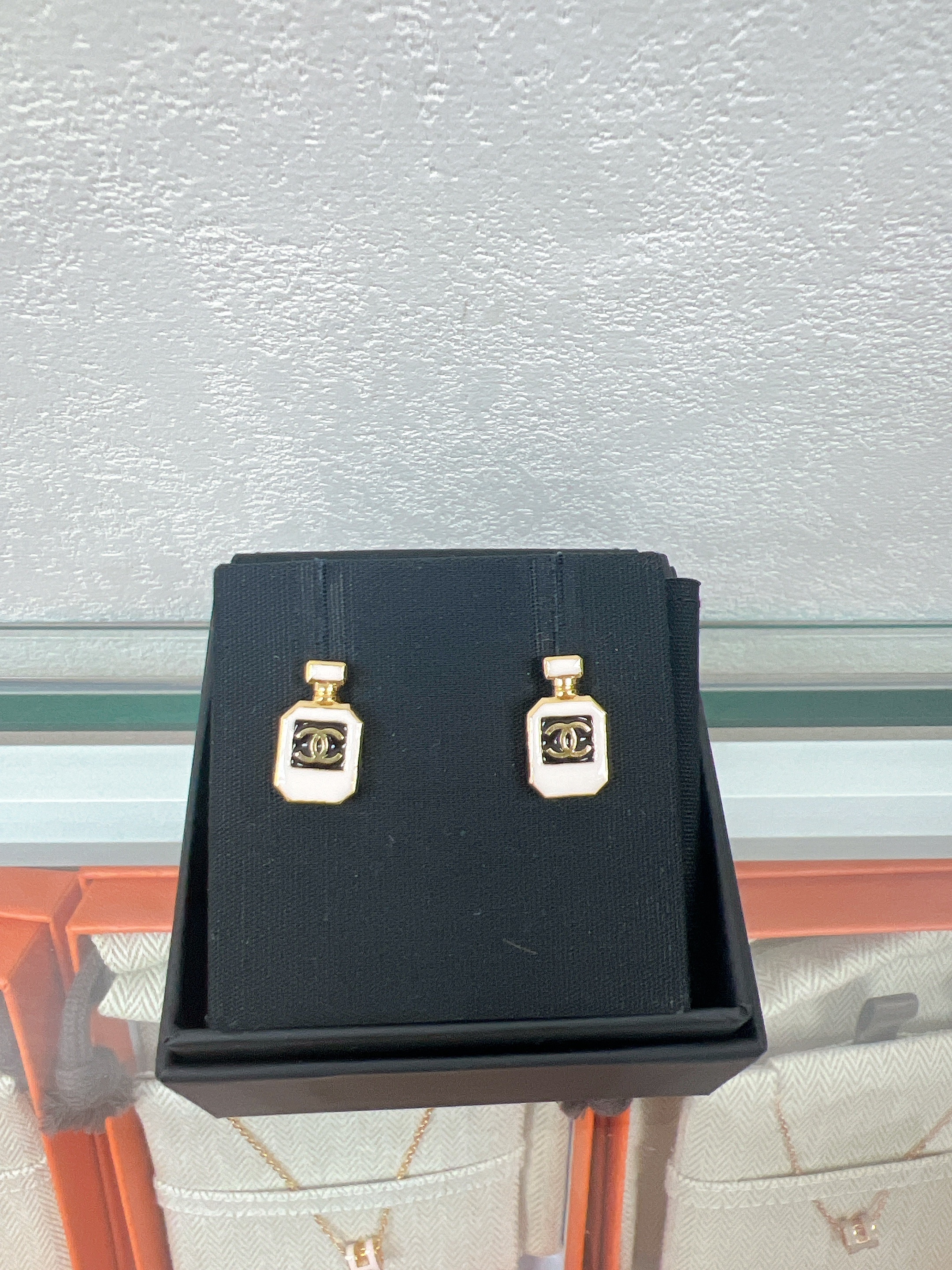 Chanel earrings 25c white perfume bottle