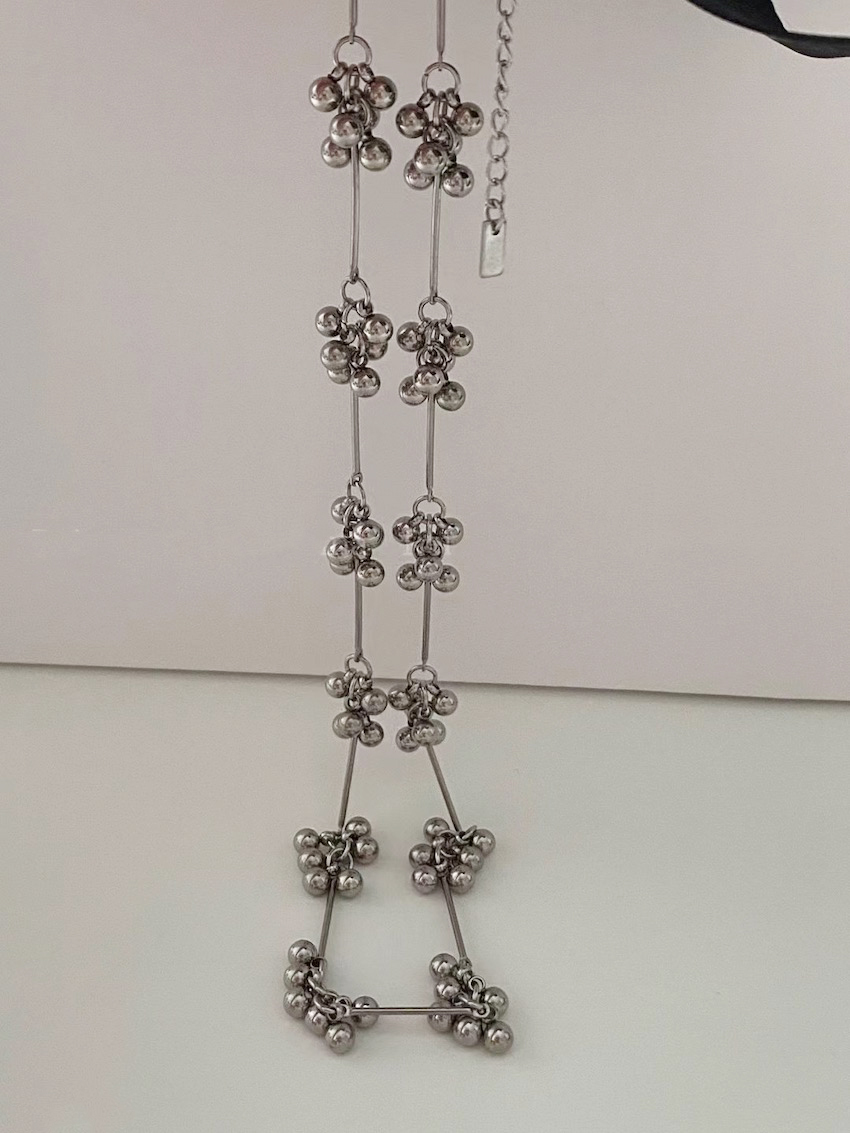 delicate vertical necklace with small bead details