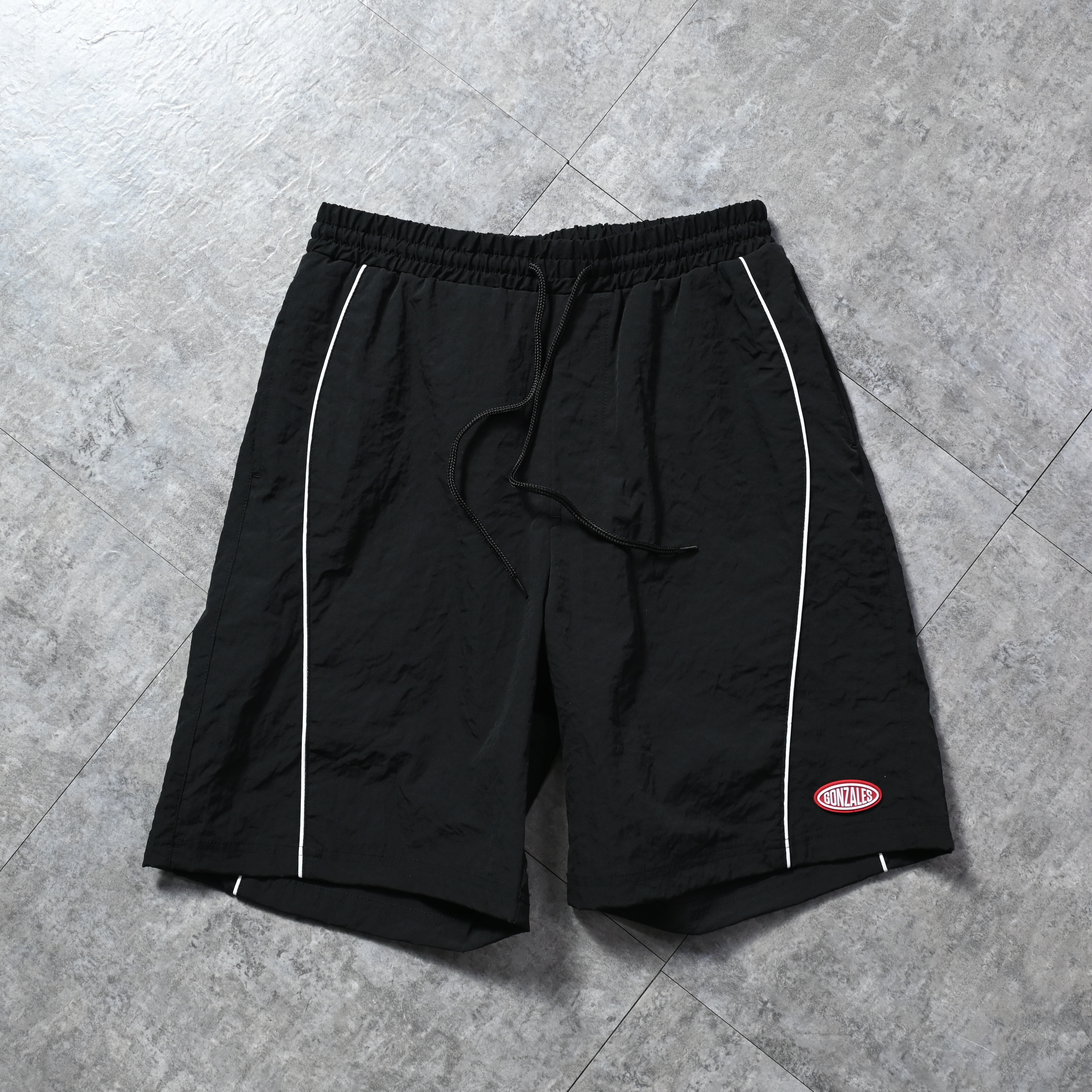 (What it isNt) ART BY MARK GONZALES Piping track shorts