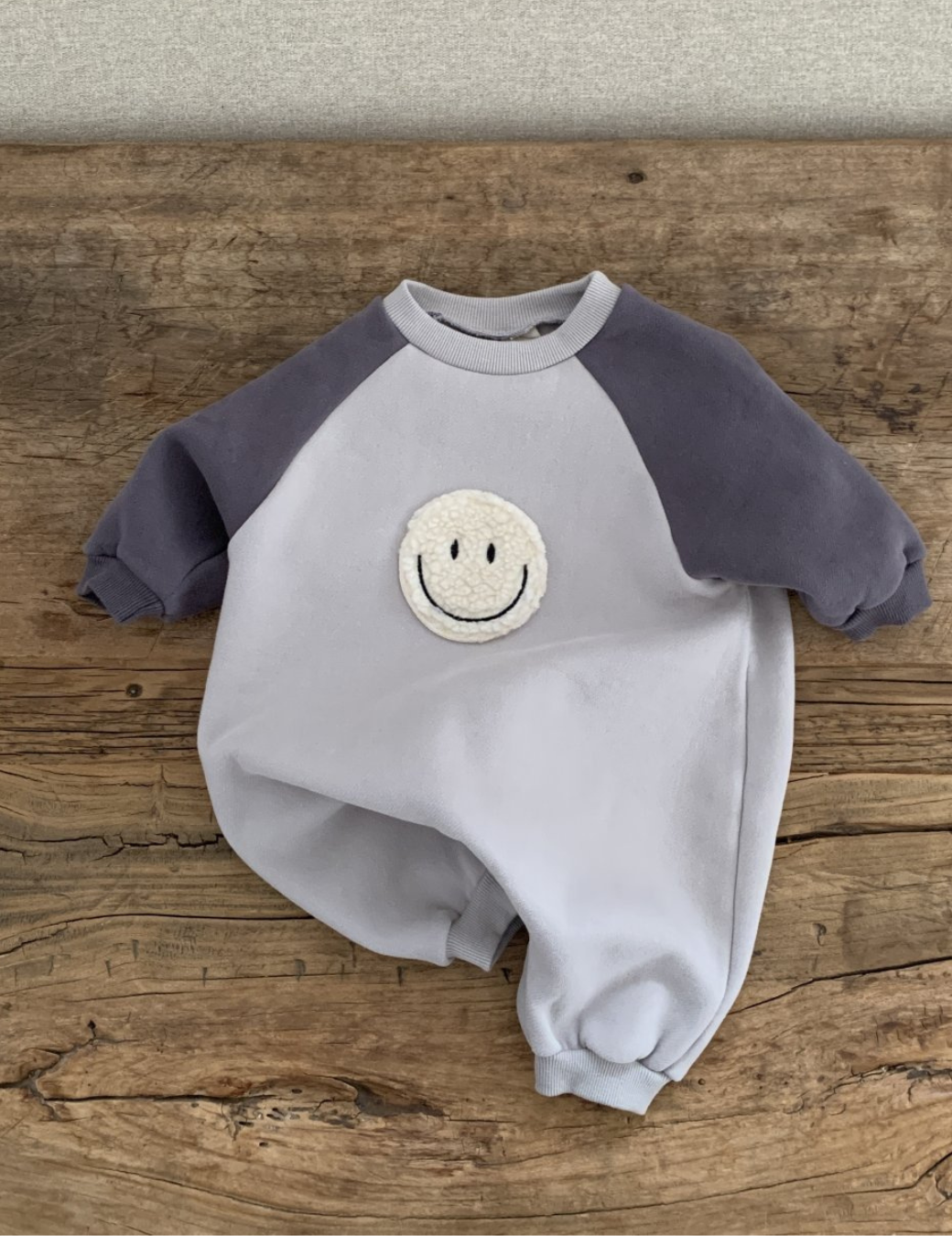 立體毛毛微笑臉包屁衣（2尺寸）