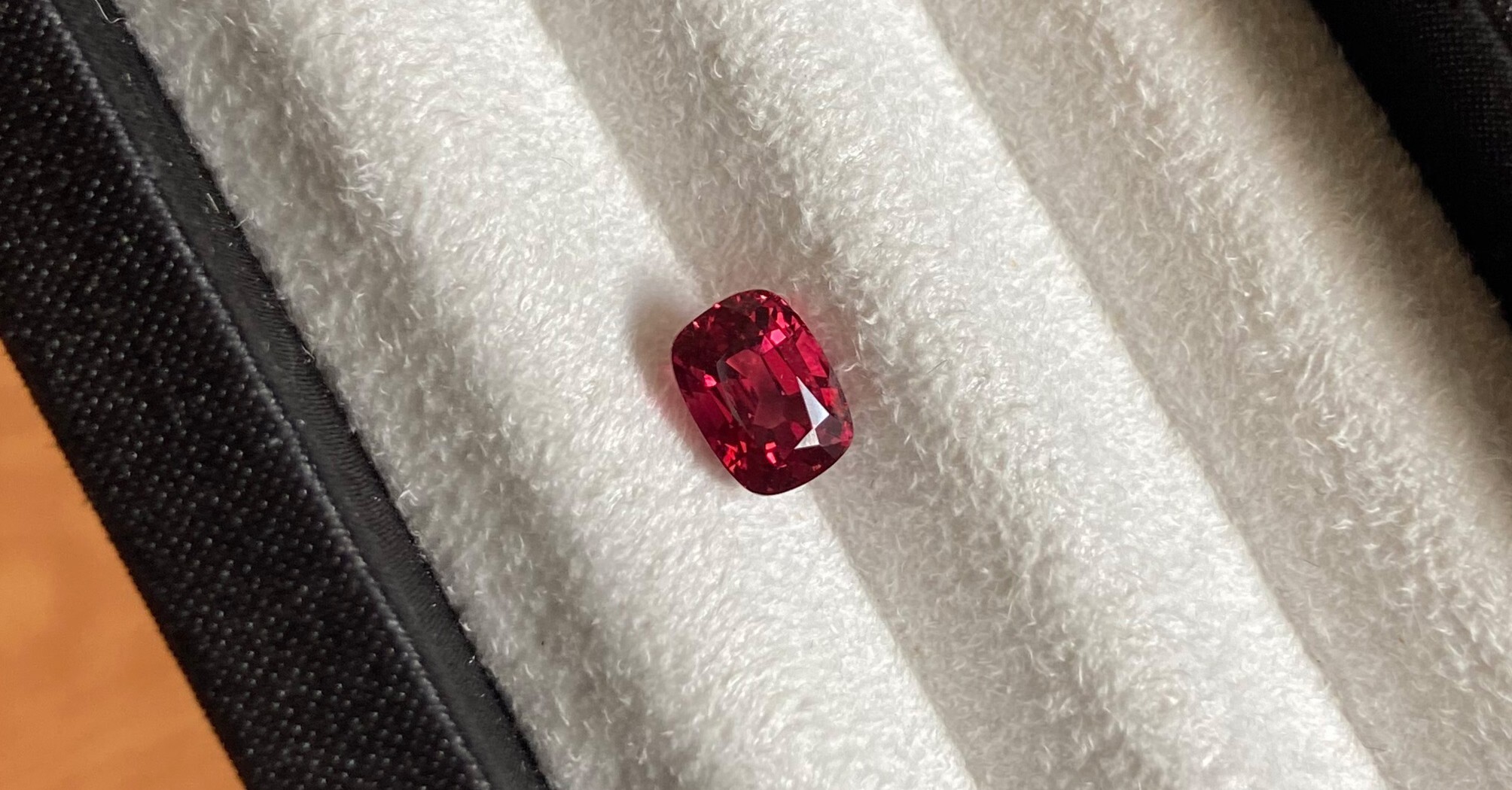 A 1.27 carat cushion-cut red spinel.