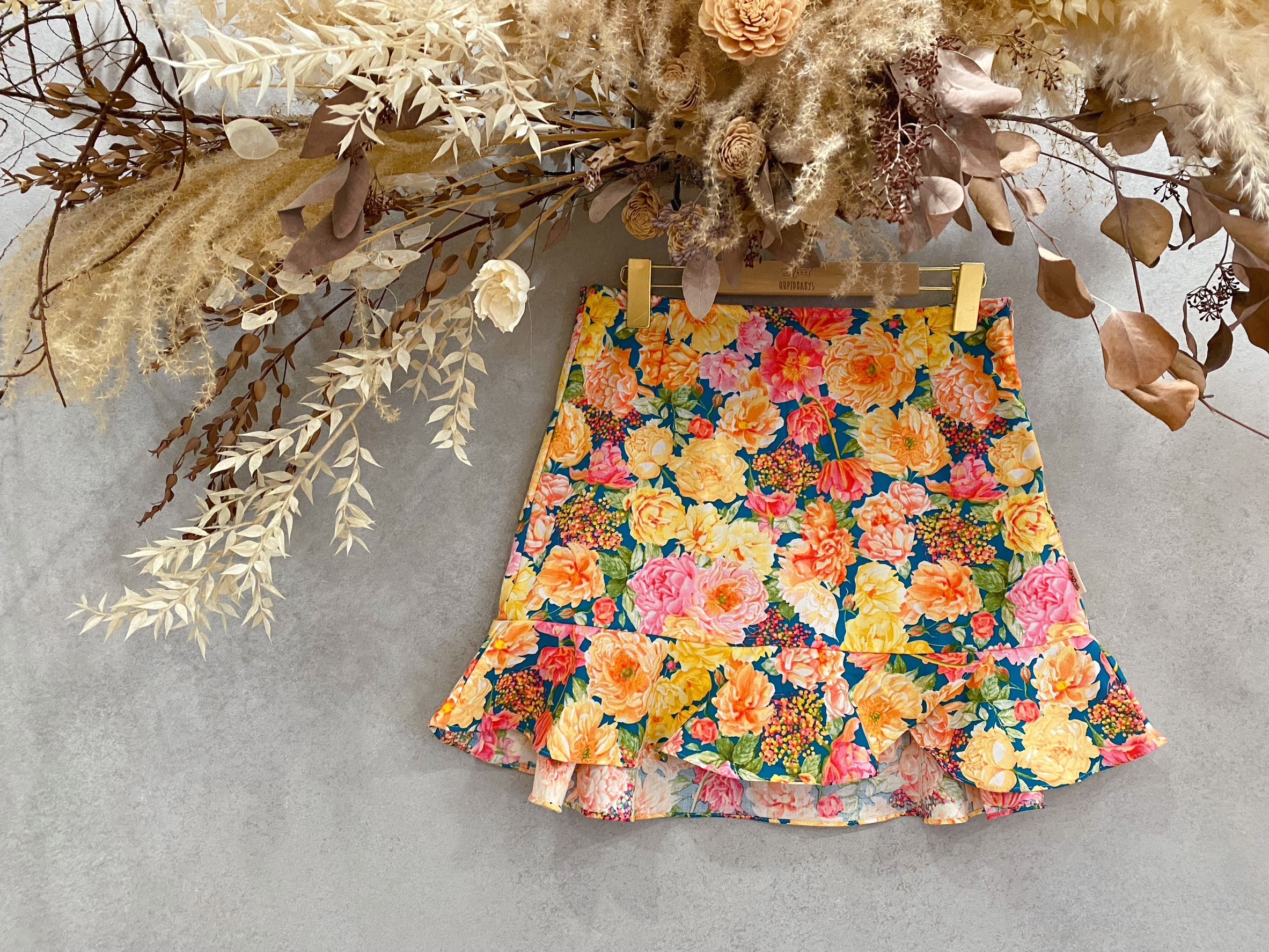 藍綠底粉橘牡丹 媽咪波浪連褲短裙(M)