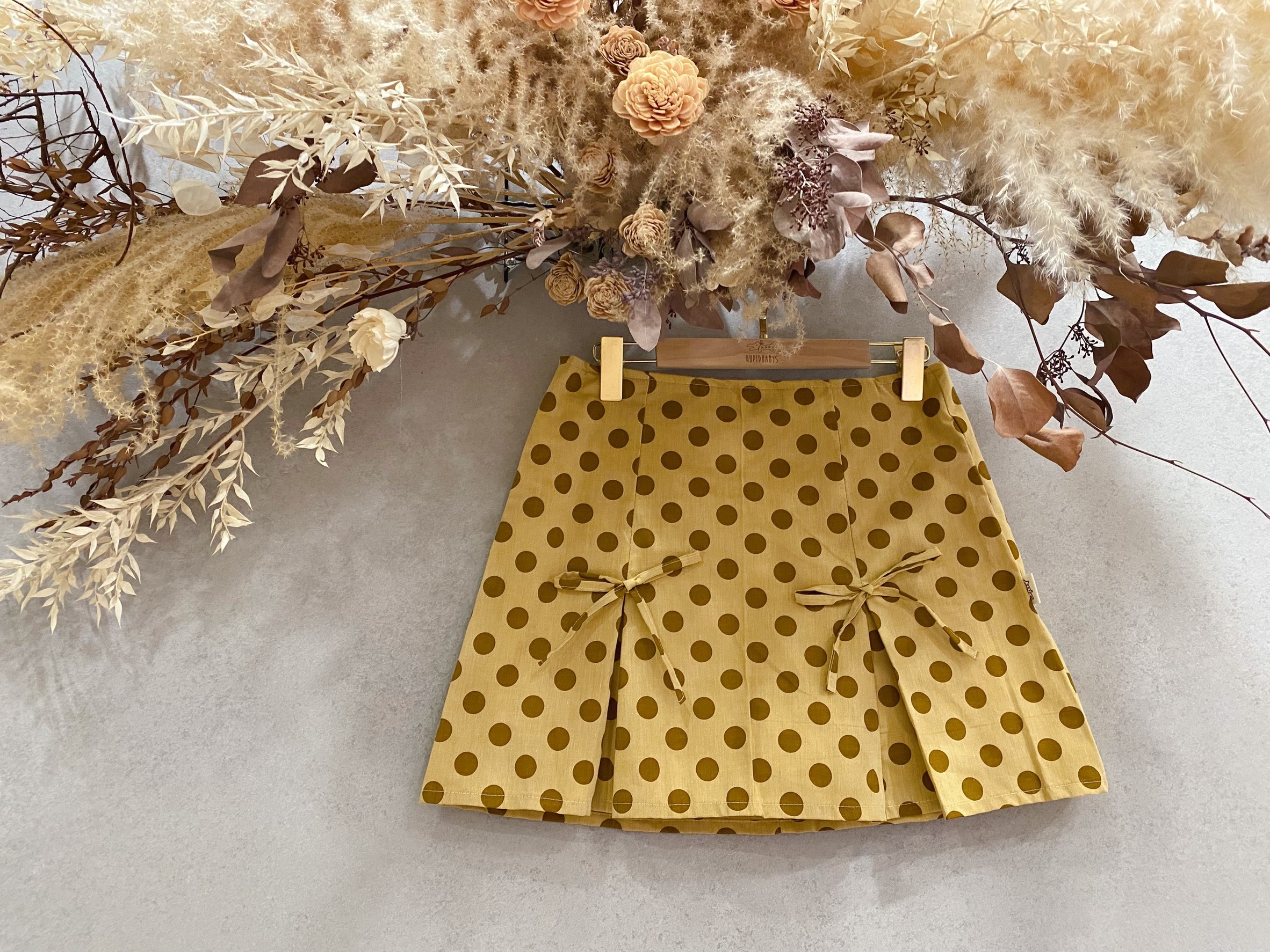 tilda 奶茶水玉 媽咪蝴蝶結連褲短裙(XS)