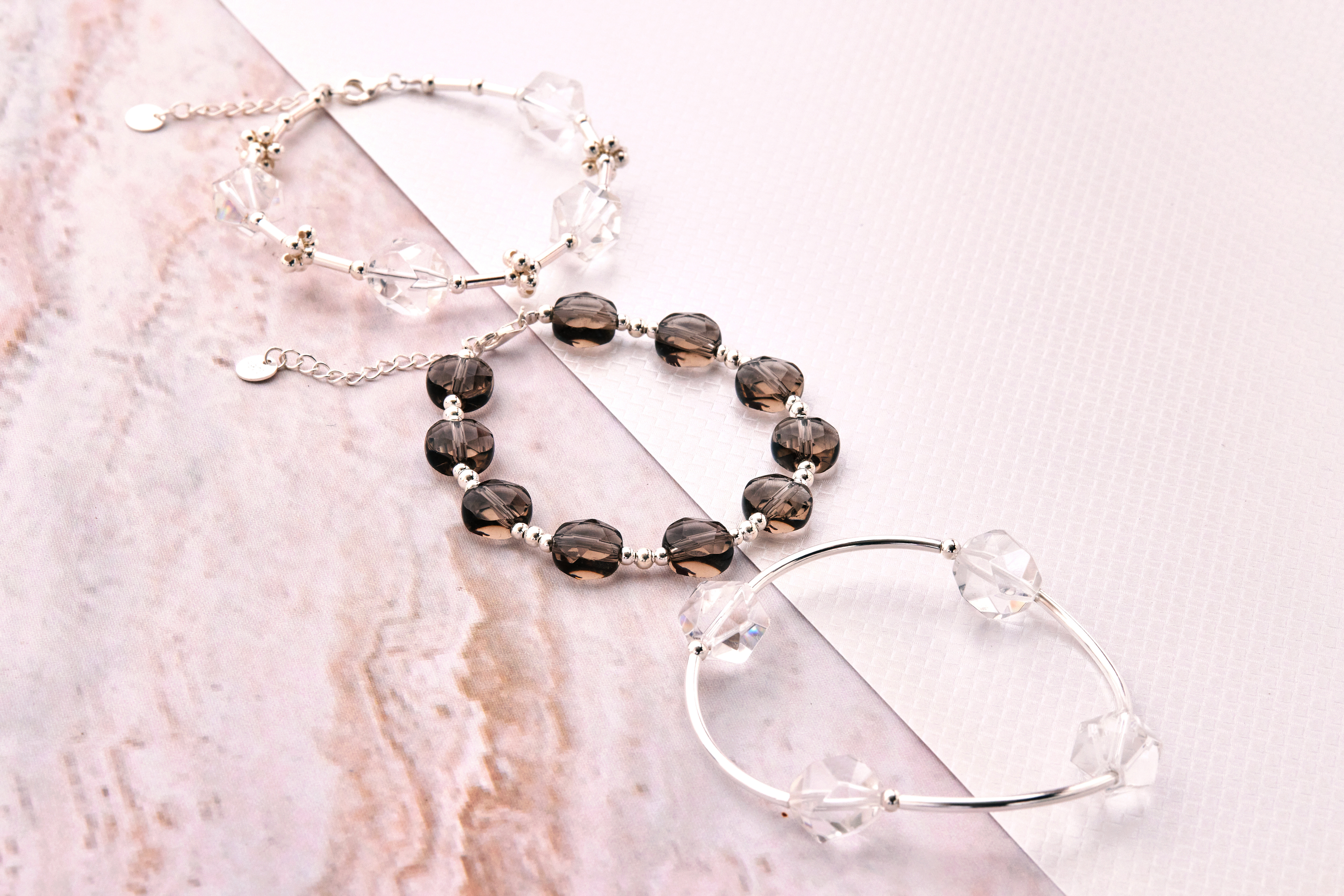 純銀竹節水晶手鍊與其他兩款水晶手鍊合照，展現不同設計的搭配風格