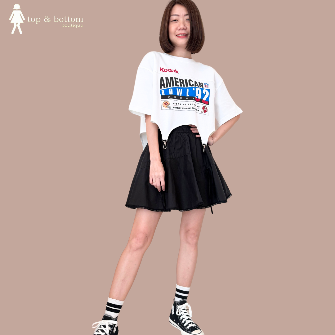 ELASTIC WAISTED RIBBON KNOT SHORT SKIRT