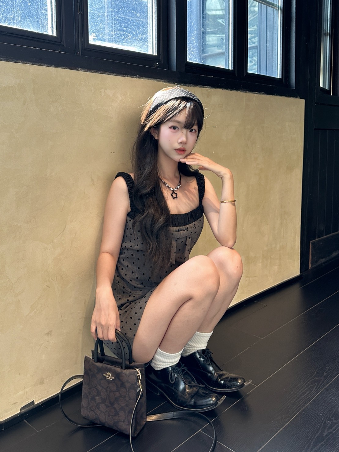 COACH蔻馳 經典老花滿印 黑棕色琴譜包 迷你款