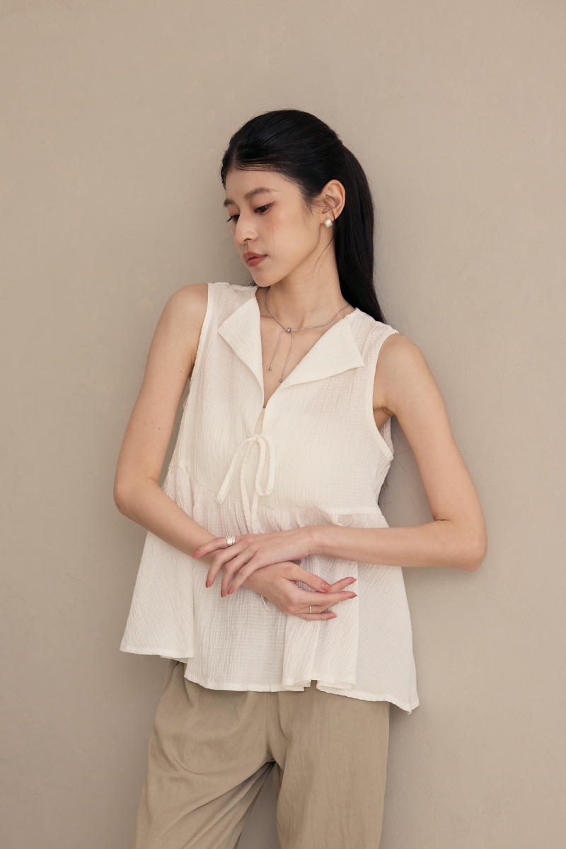 無袖半開襟壓紋傘襬上衣