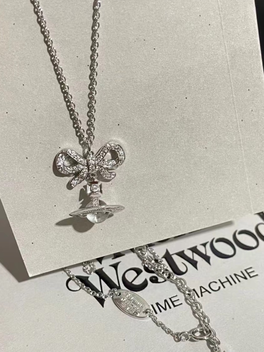 VIVIENNE WESTWOOD OCTAVIE ORB 白晶蝴蝶結 透明球土星吊墜 白球 項鍊