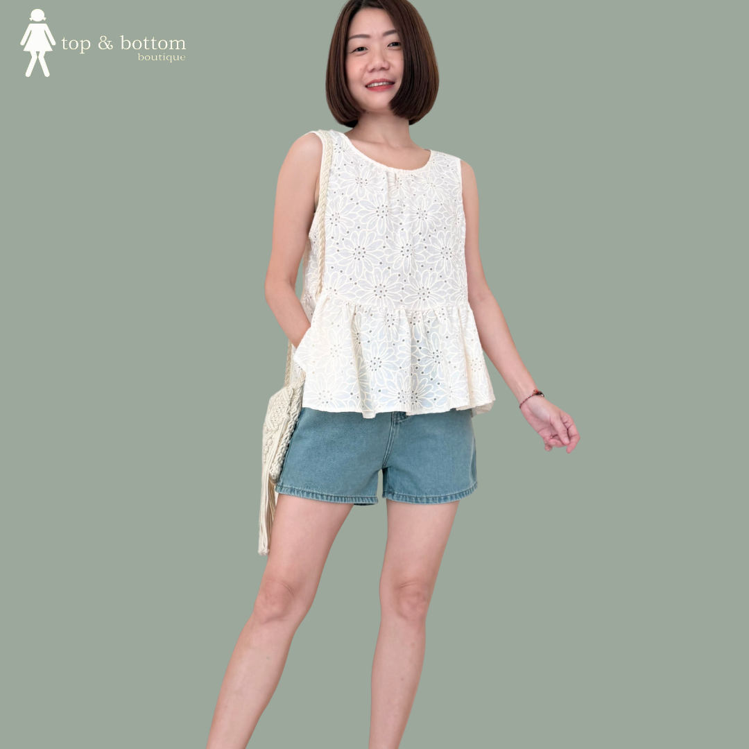 SLEEVELESS PRINTED FLORAL PEPLUM BLOUSE