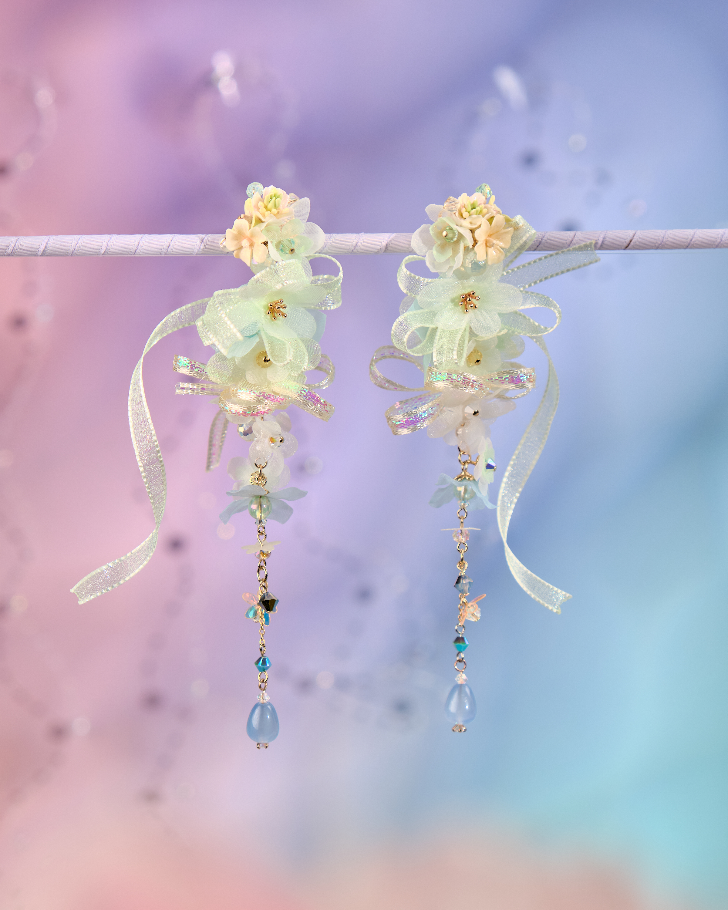 12079 絲帶小花羽翼耳環