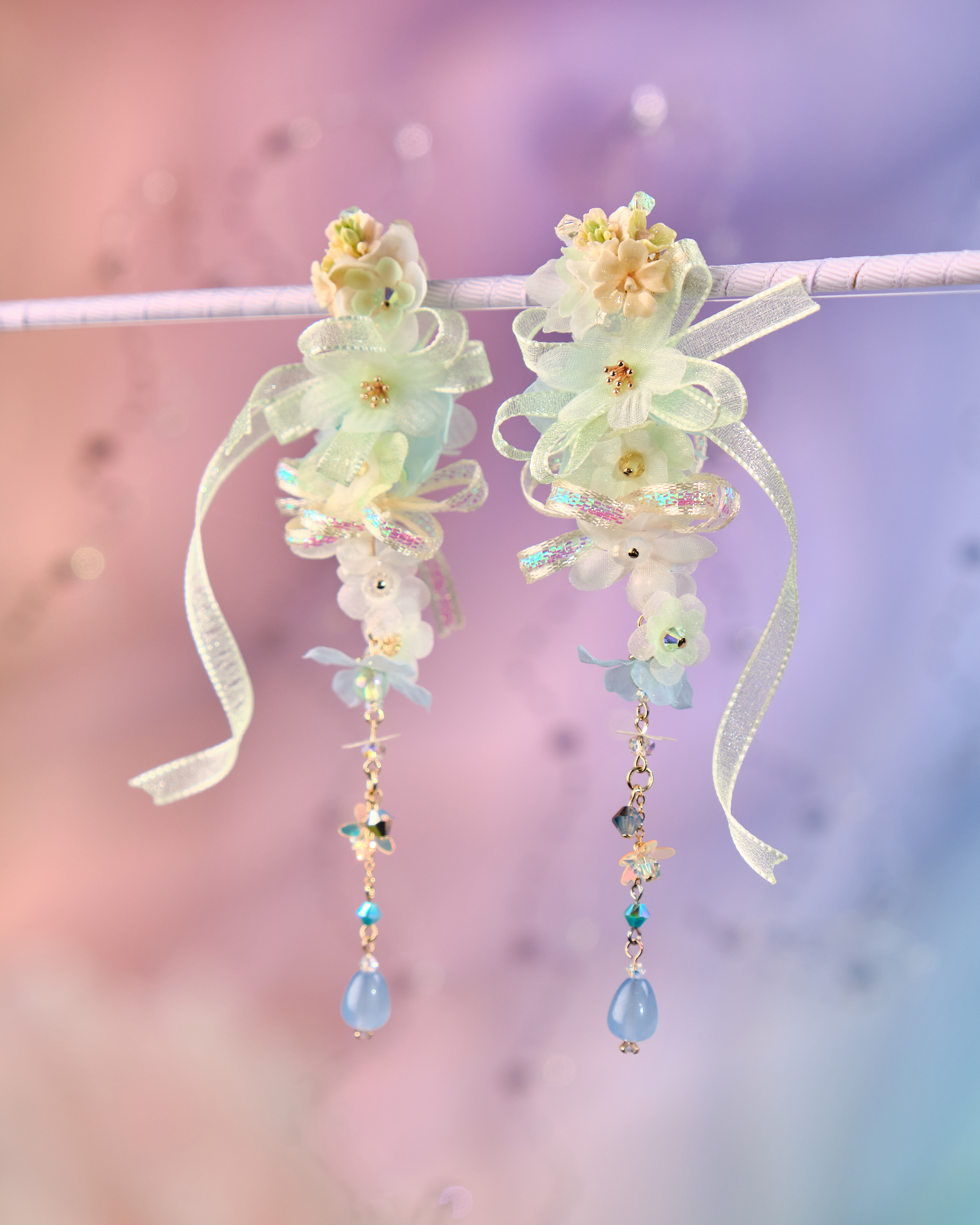 12079 絲帶小花羽翼耳環