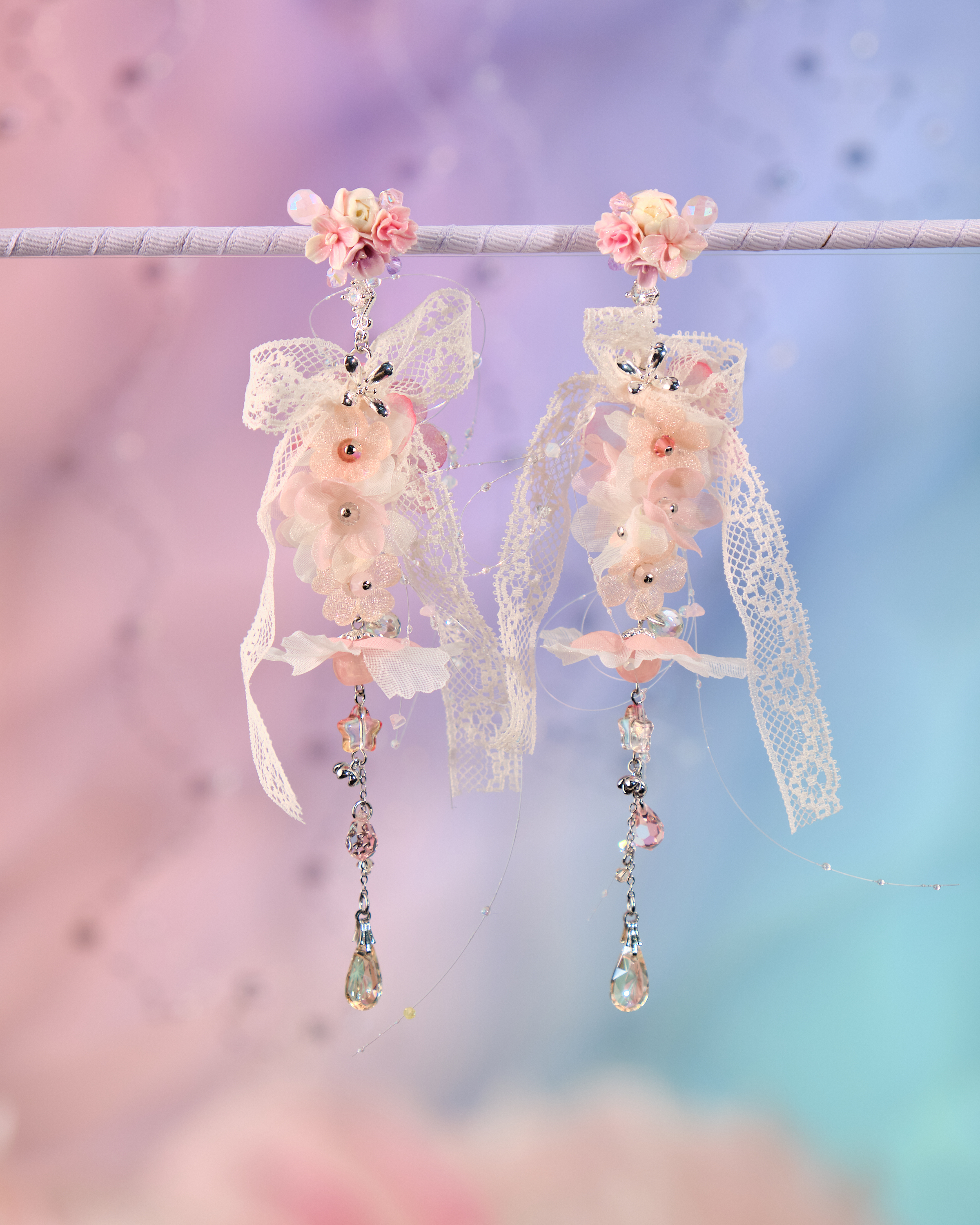 12077 絲帶小花羽翼耳環