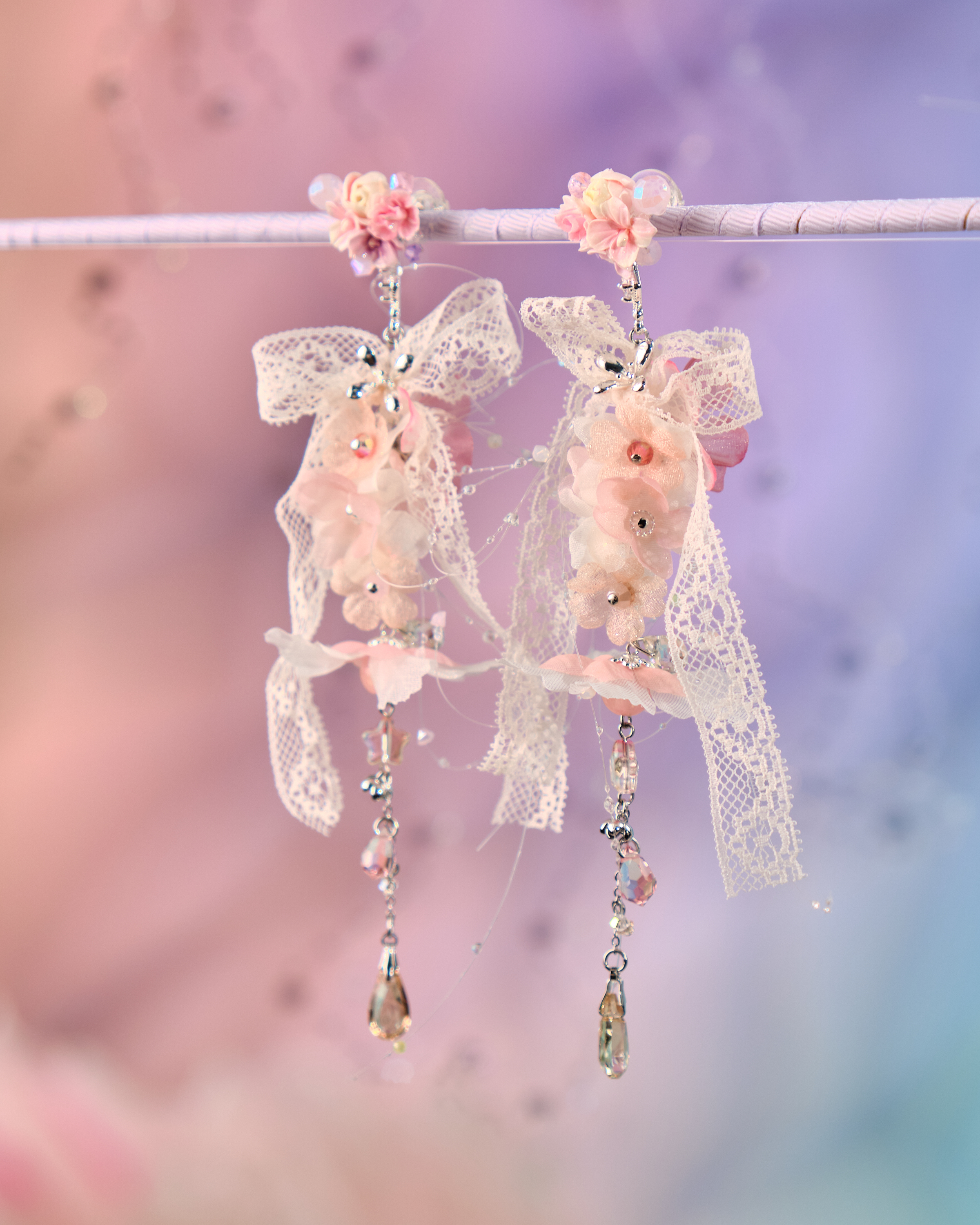 12077 絲帶小花羽翼耳環