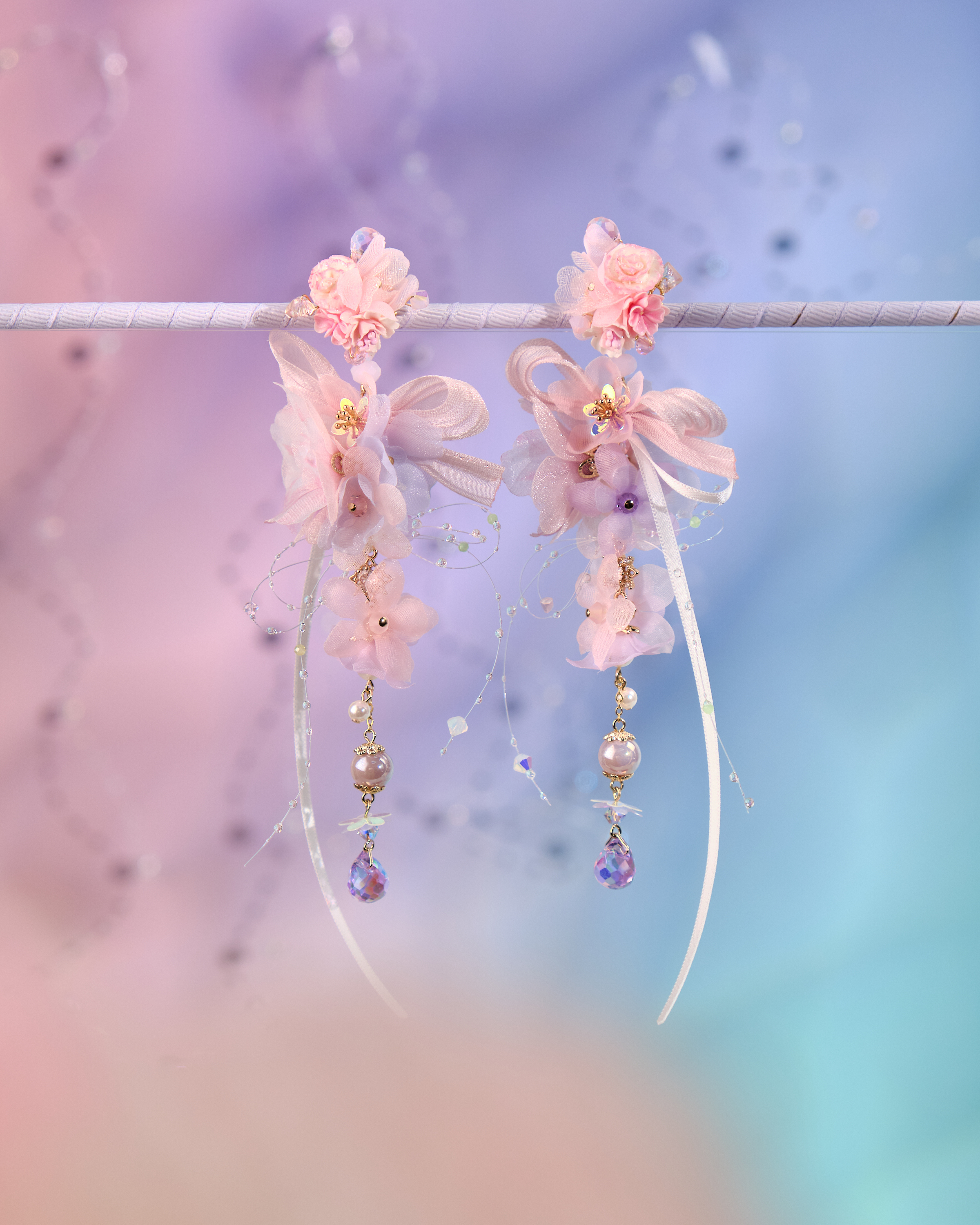 12074 絲帶小花羽翼耳環