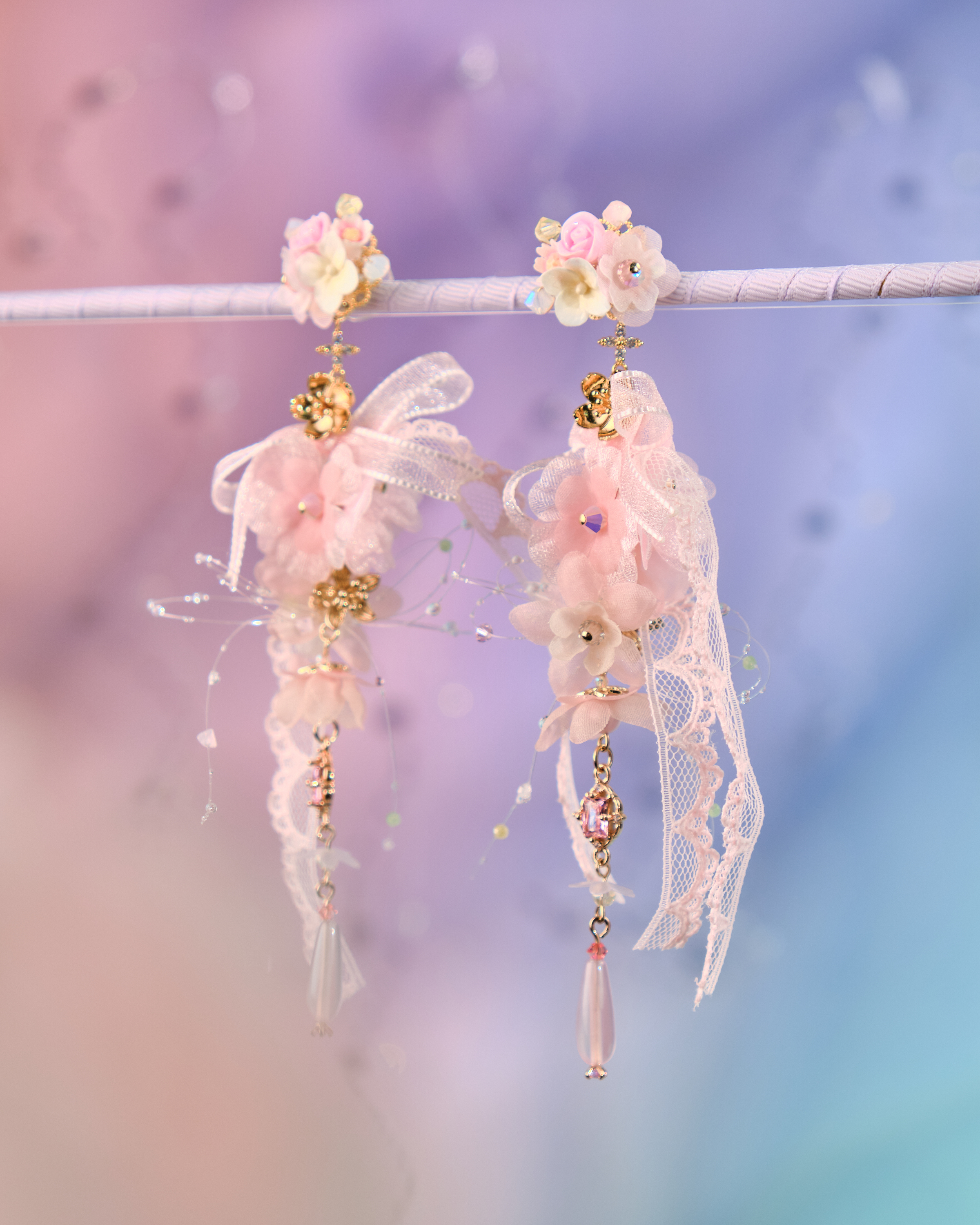 12073 絲帶小花羽翼耳環