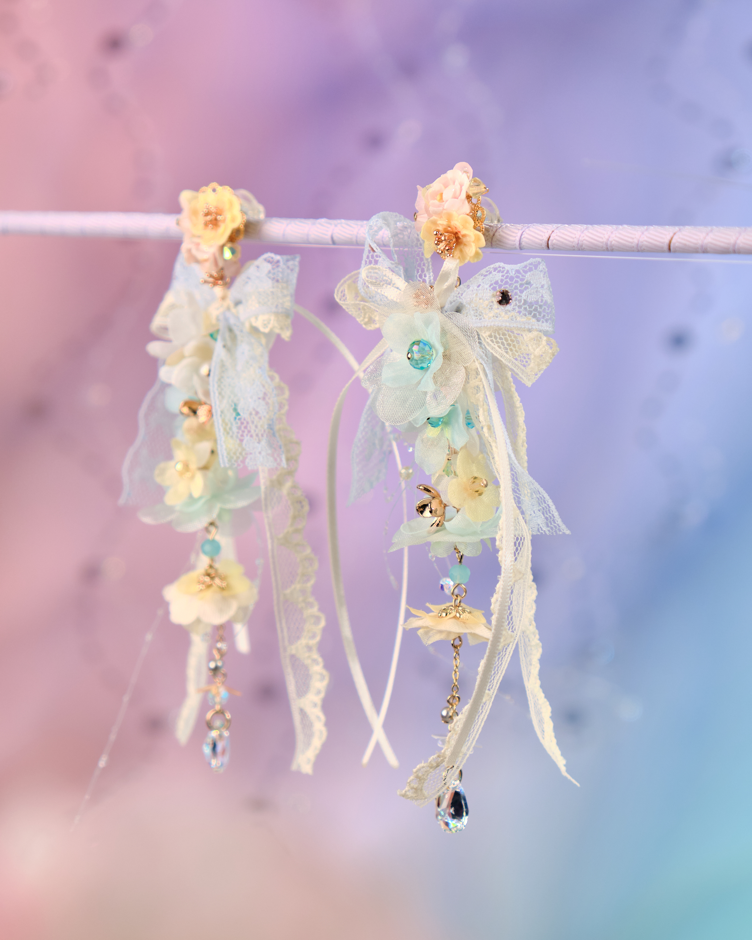 12071 絲帶小花羽翼耳環