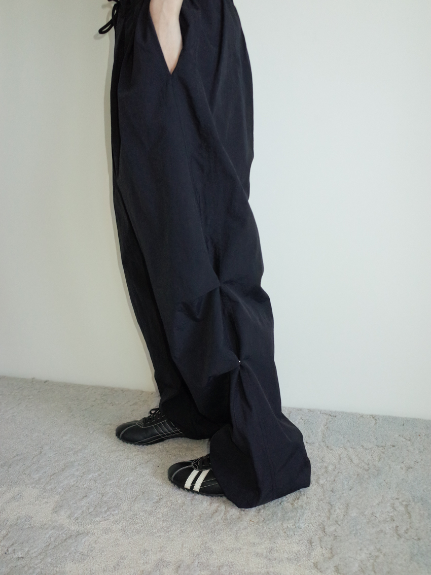(UNISEX) nylon wide-leg trousers with elastic drawstring waist & round button detail in BLACK