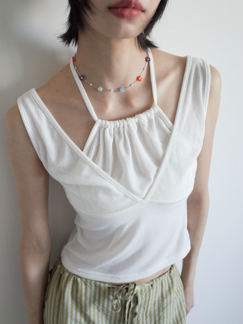 elegant beaded necklace with tiny floral charms