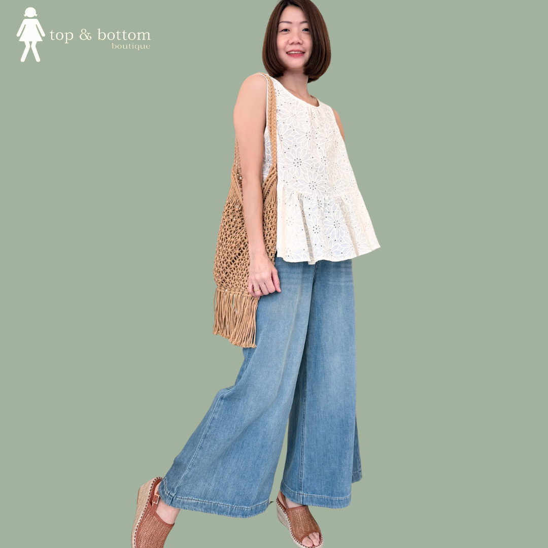 SLEEVELESS PRINTED FLORAL PEPLUM BLOUSE