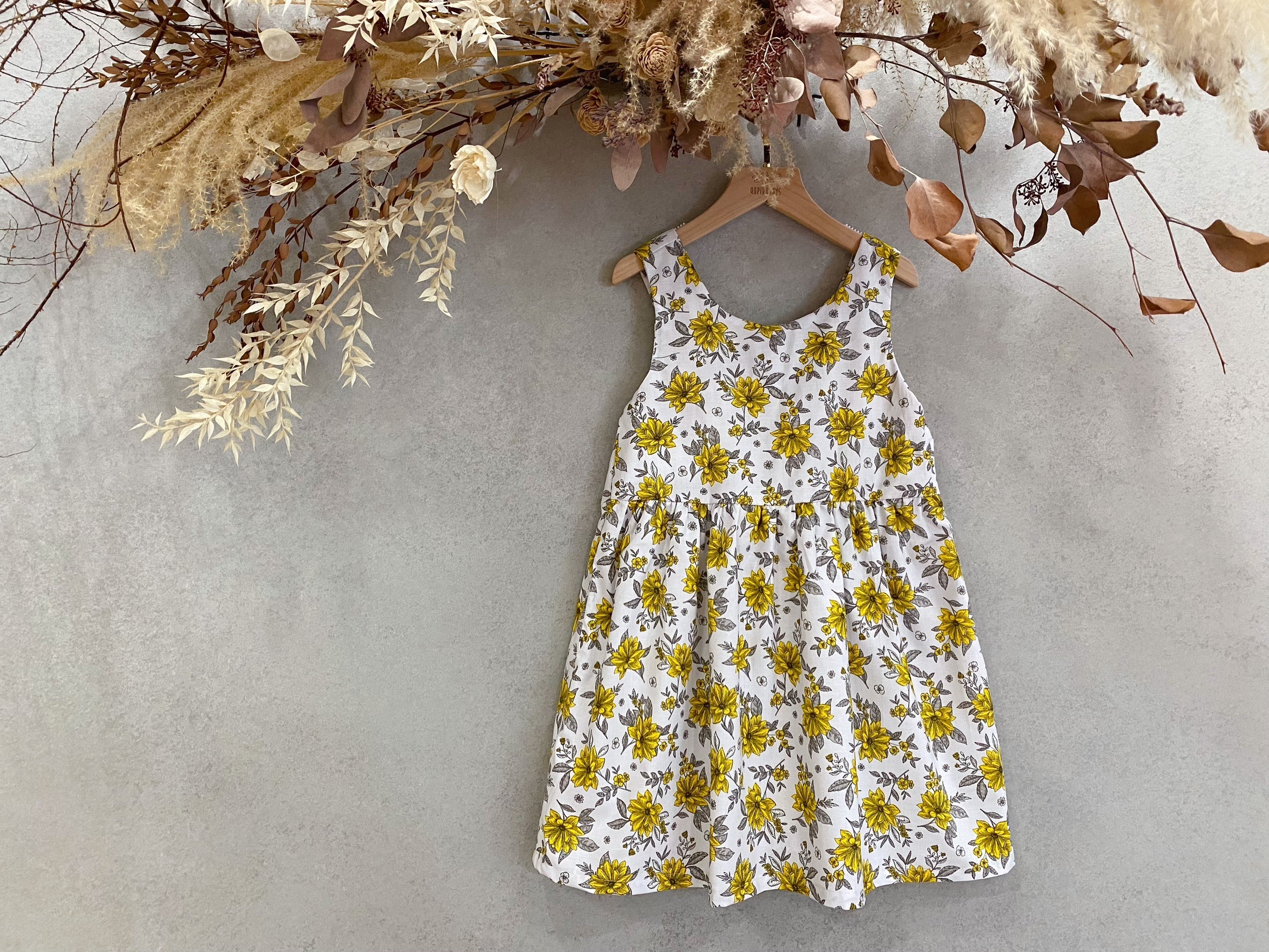 線條黃花 背蝴蝶結洋裝(140)