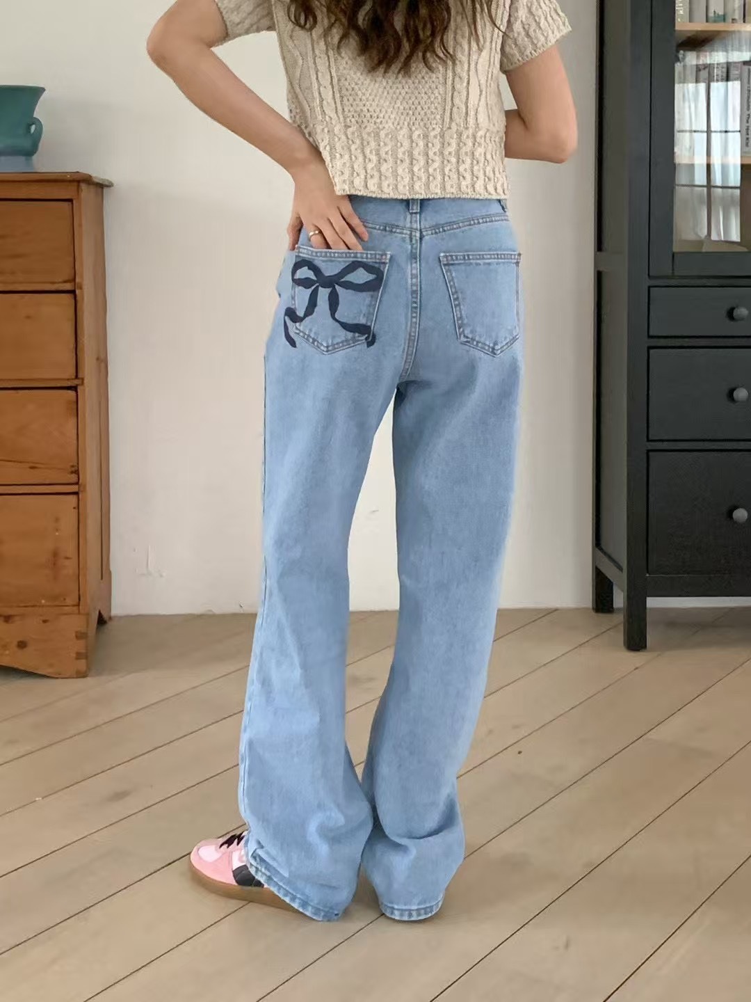 423背口袋蝴蝶結牛仔長褲