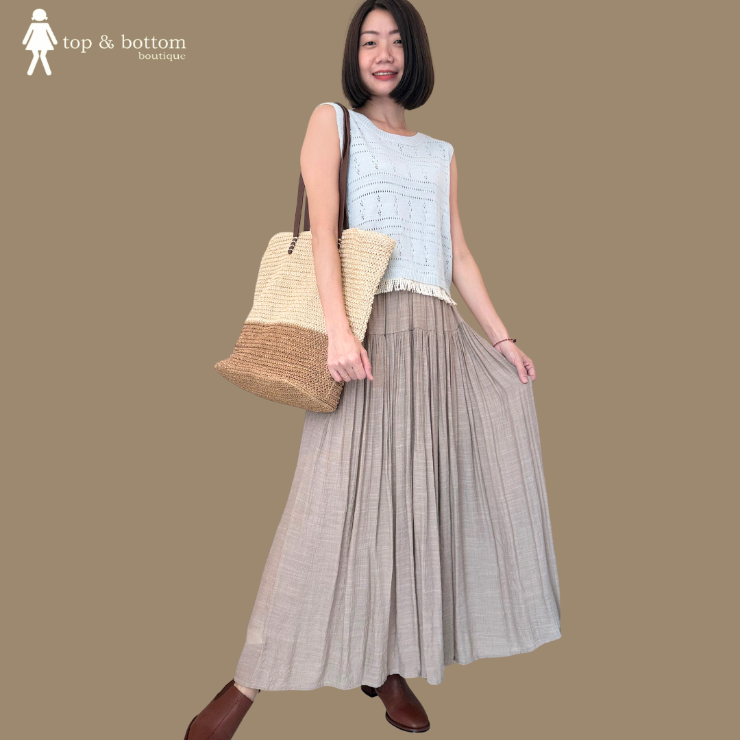 SLEEVELESS KNIT BLOUSE WITH COTTON TASSEL HEM