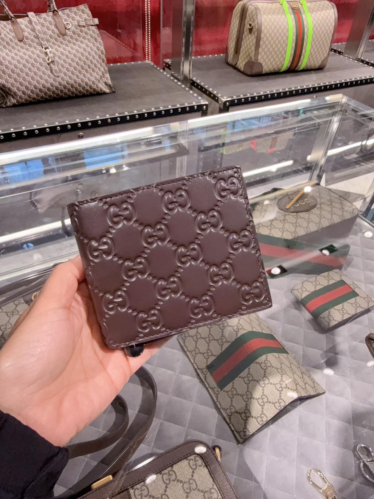 Gucci Signature Leather Calf embossed GG bi-fold wallet brown 779836