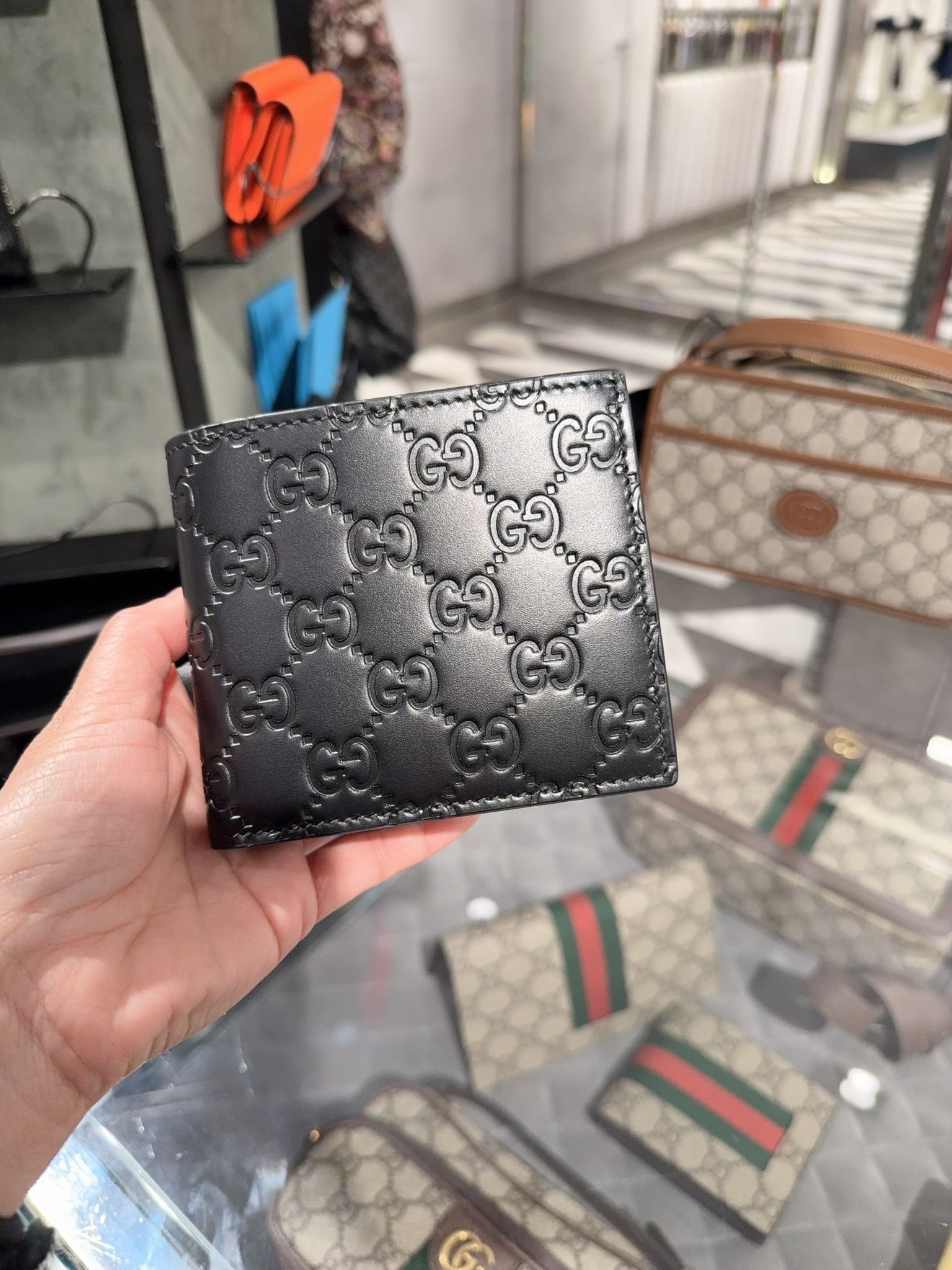 Gucci Signature leather calf bi-fold wallet in black 779841
