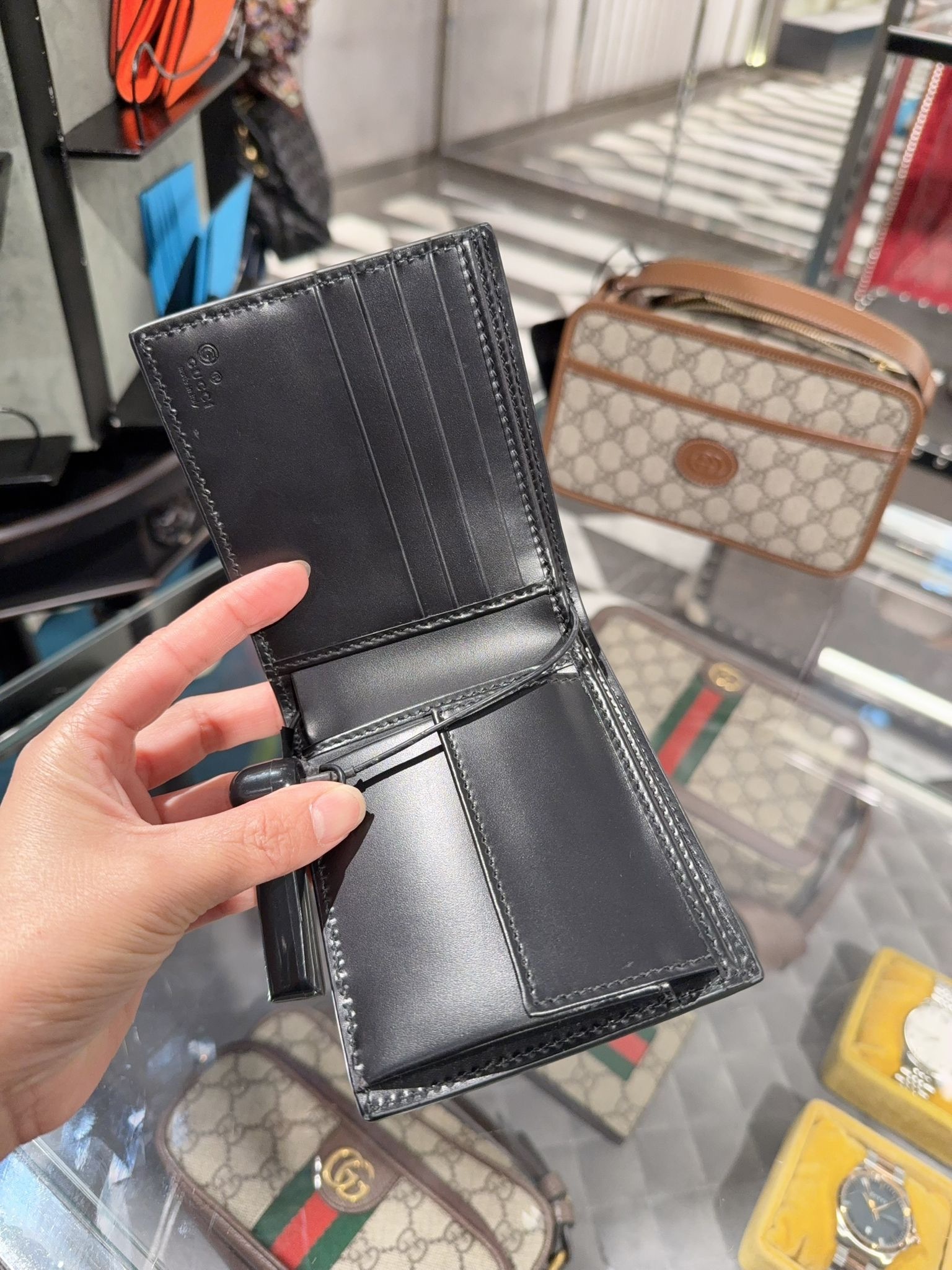 Gucci Signature leather calf bi-fold wallet in black 779841