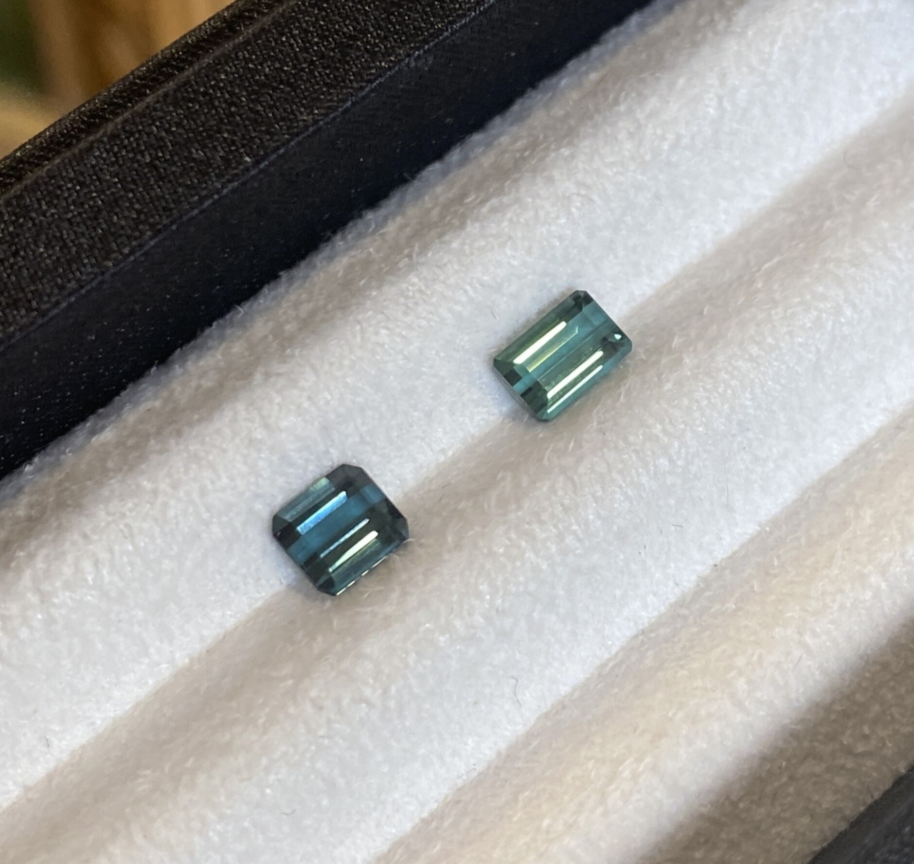 Two natural indicotite tourmalines in emerald cut, weighing 0.74 ct, and 0.76 ct from right to left.