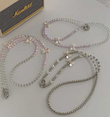 超甜美珍珠蝴蝶結手機背鏈