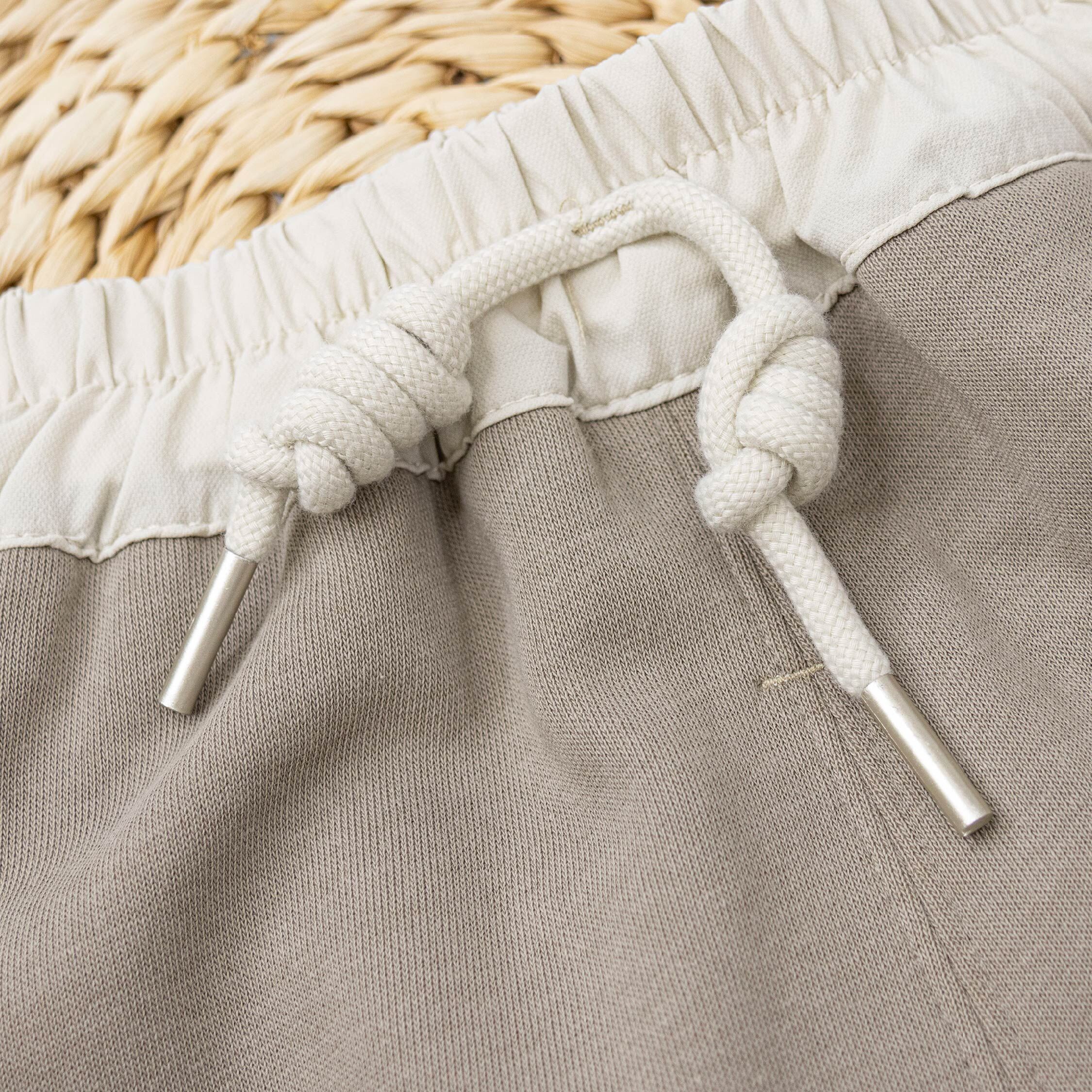 【H55262】俏皮眨眼笑臉質感縮口褲