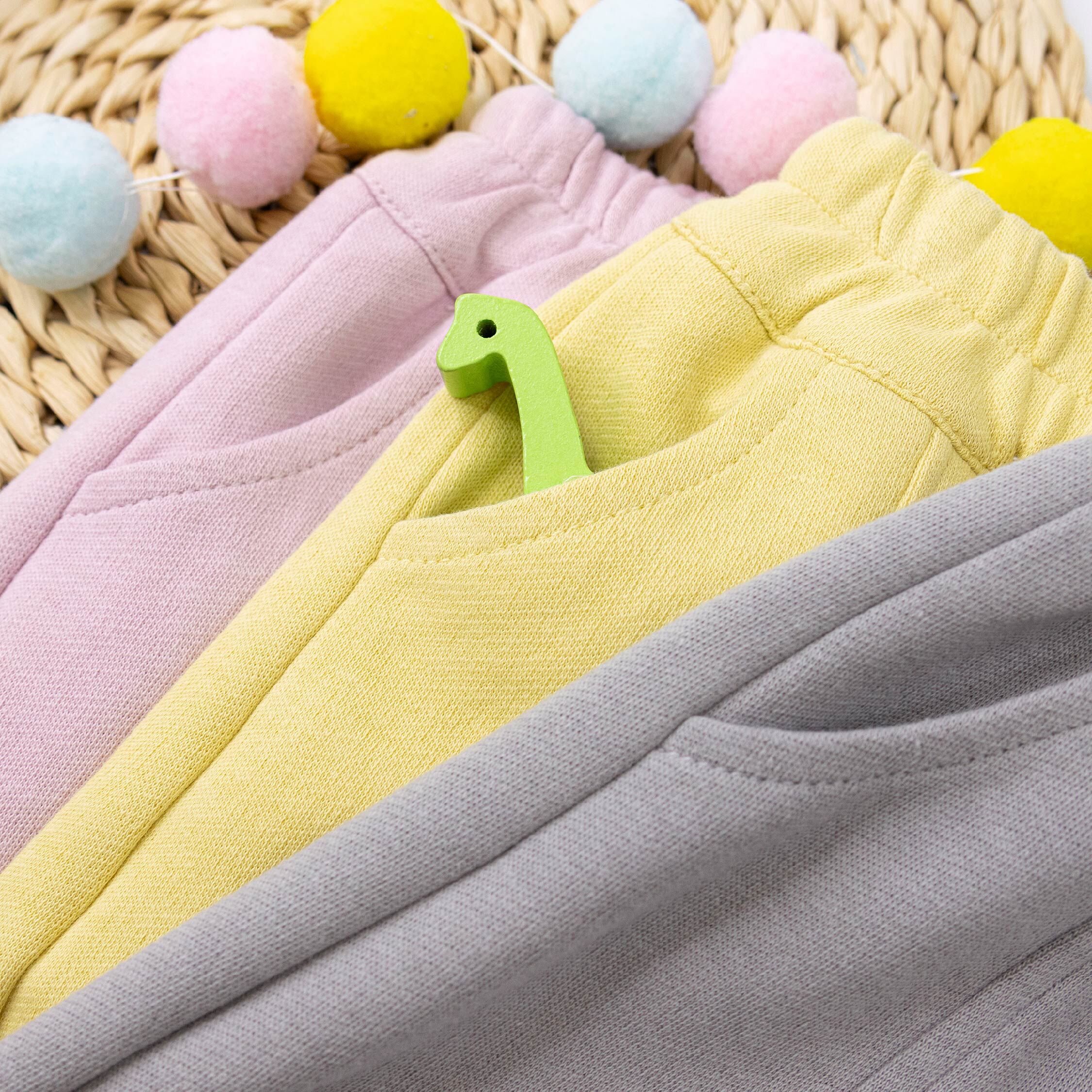 【H55261】淘氣小眼睛對稱設計縮口褲＊二色