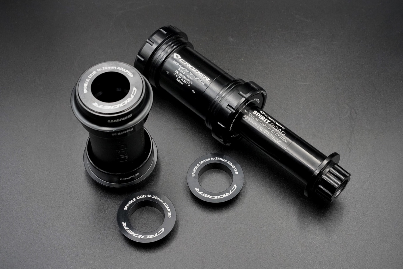 Comparison of a Shimano Hollowtech II crankset spindle and a SRAM DUB spindle.