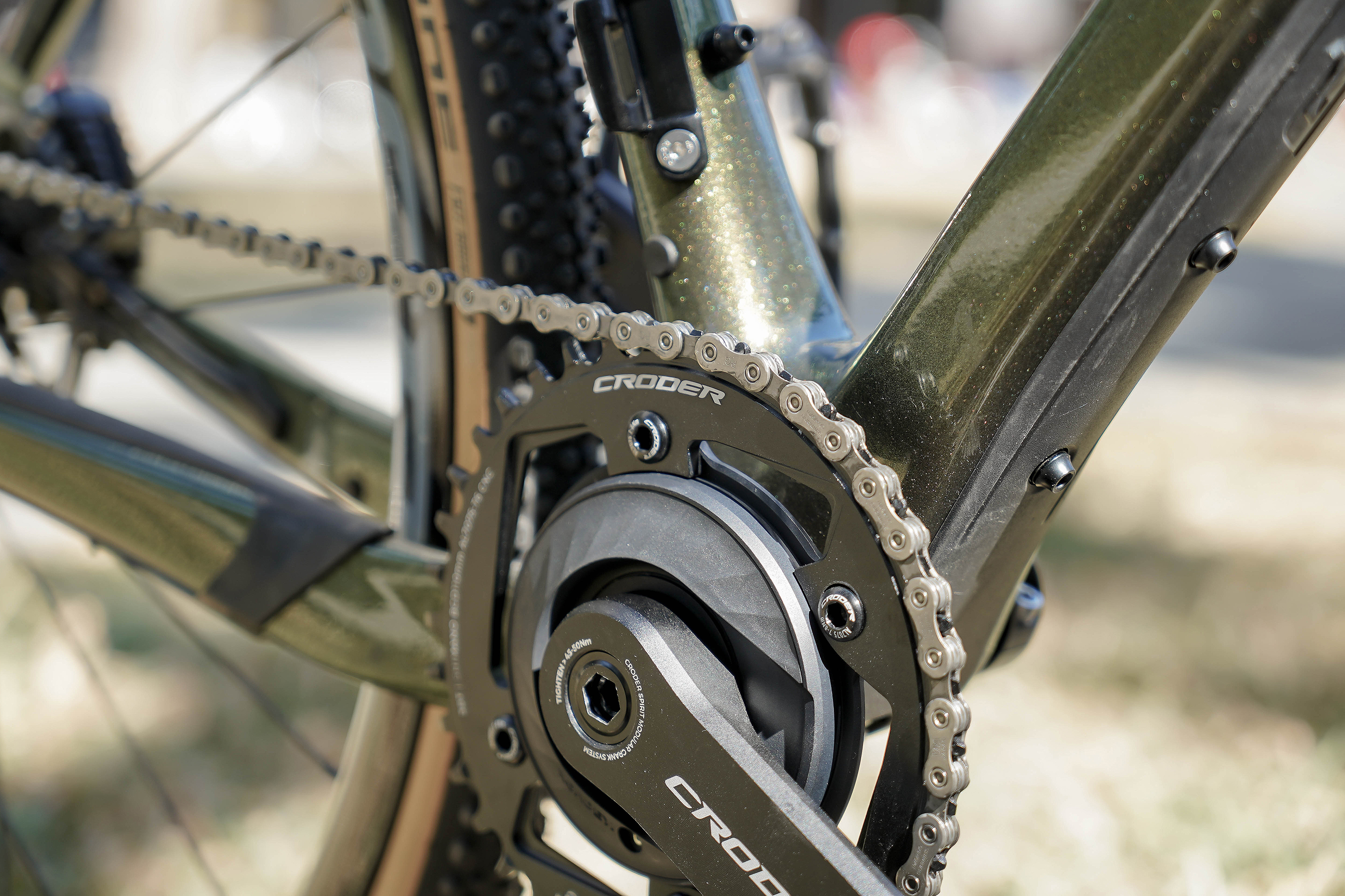Close-up of a bicycle chain on a cassette, showing the interaction during shifting.